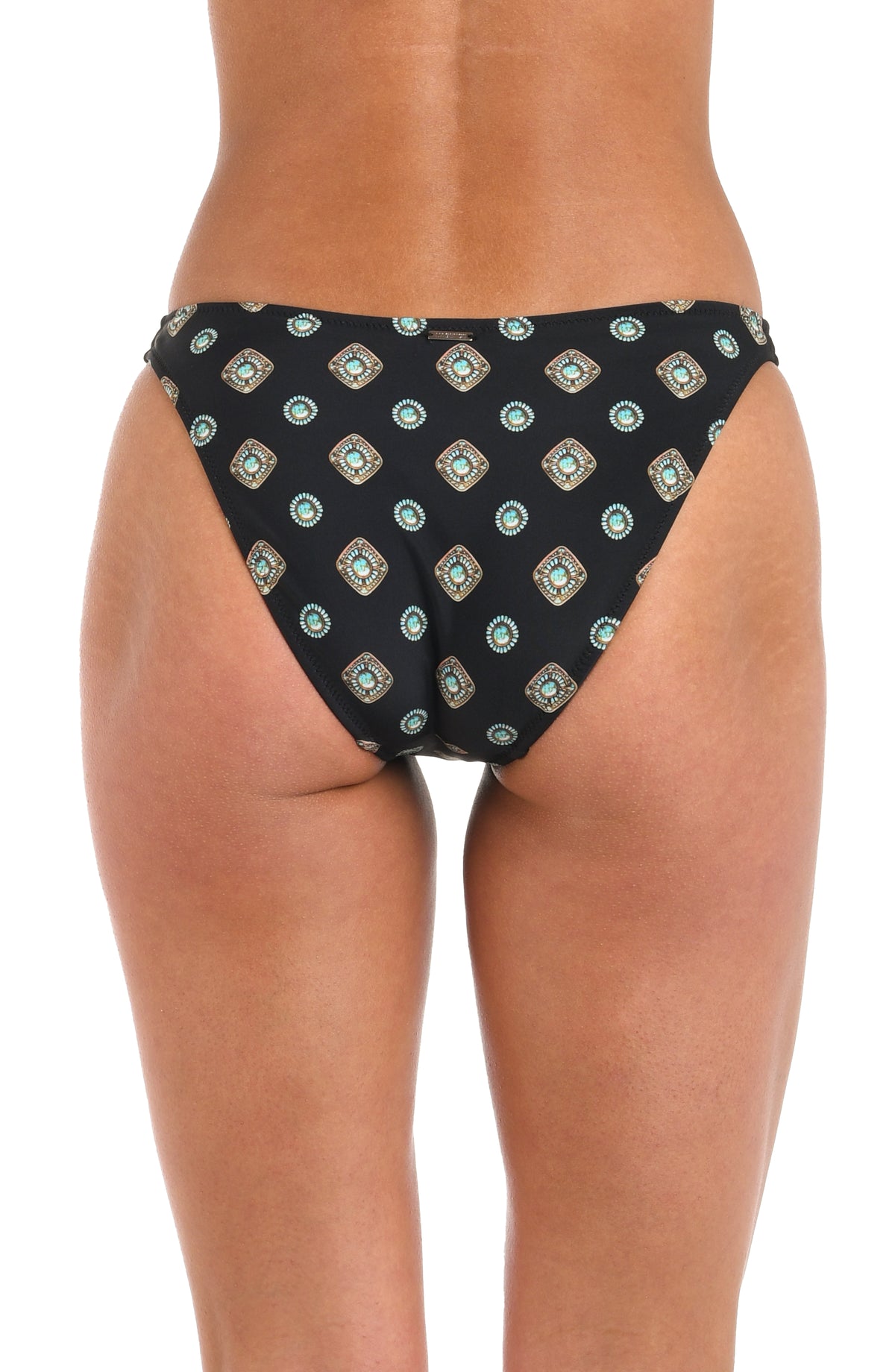 Woman wearing a black multicolored high leg bikini bottom with a geometric print set against a white background. 