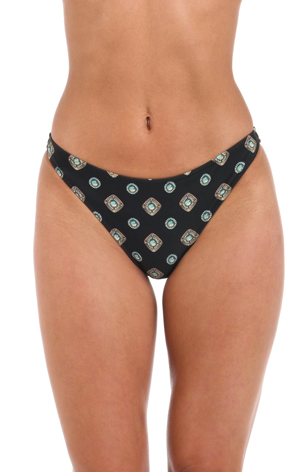 Woman wearing a black multicolored high leg bikini bottom with a geometric print set against a white background. 