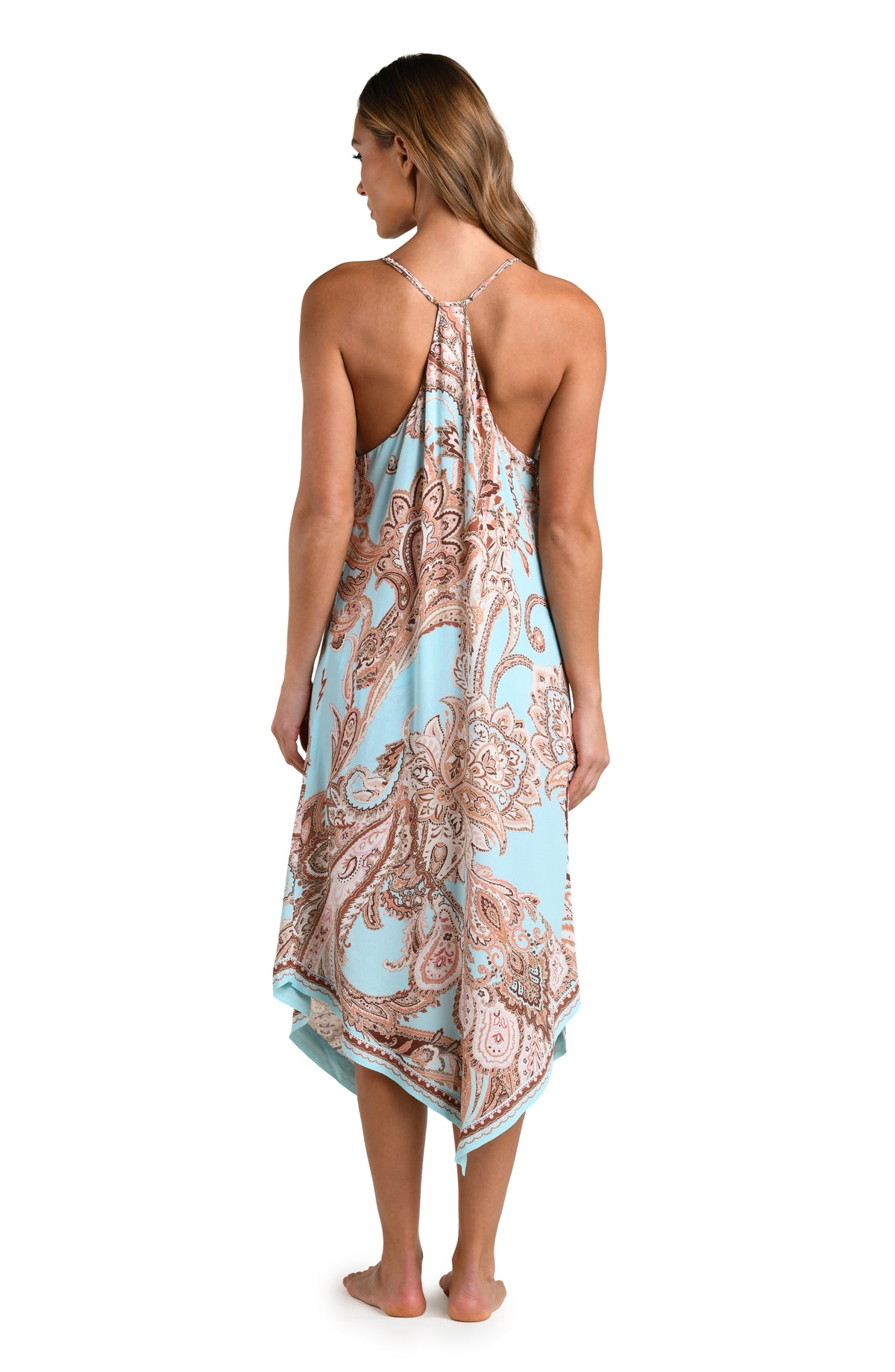 Woman wearing a multicolored paisley printed midi dress cover up against a white background. 