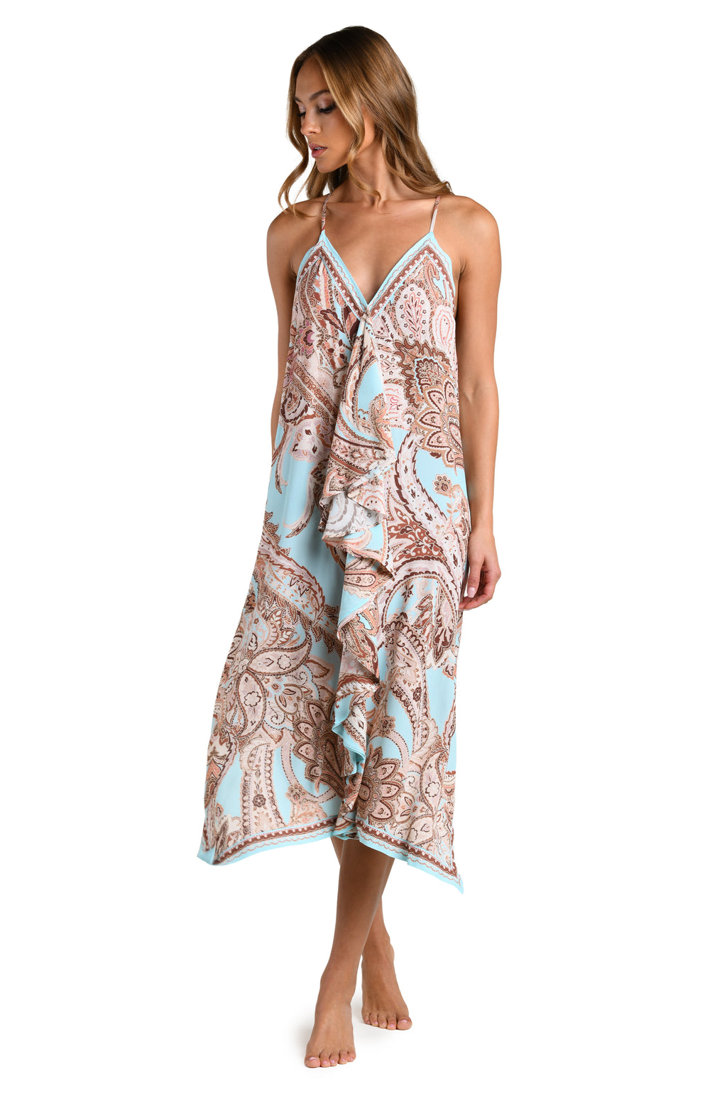 Woman wearing a multicolored paisley printed midi dress cover up against a white background. 
