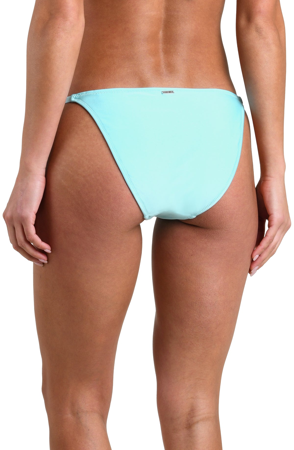 Woman wearing an ice blue colored bikini bottom against a white background. 
