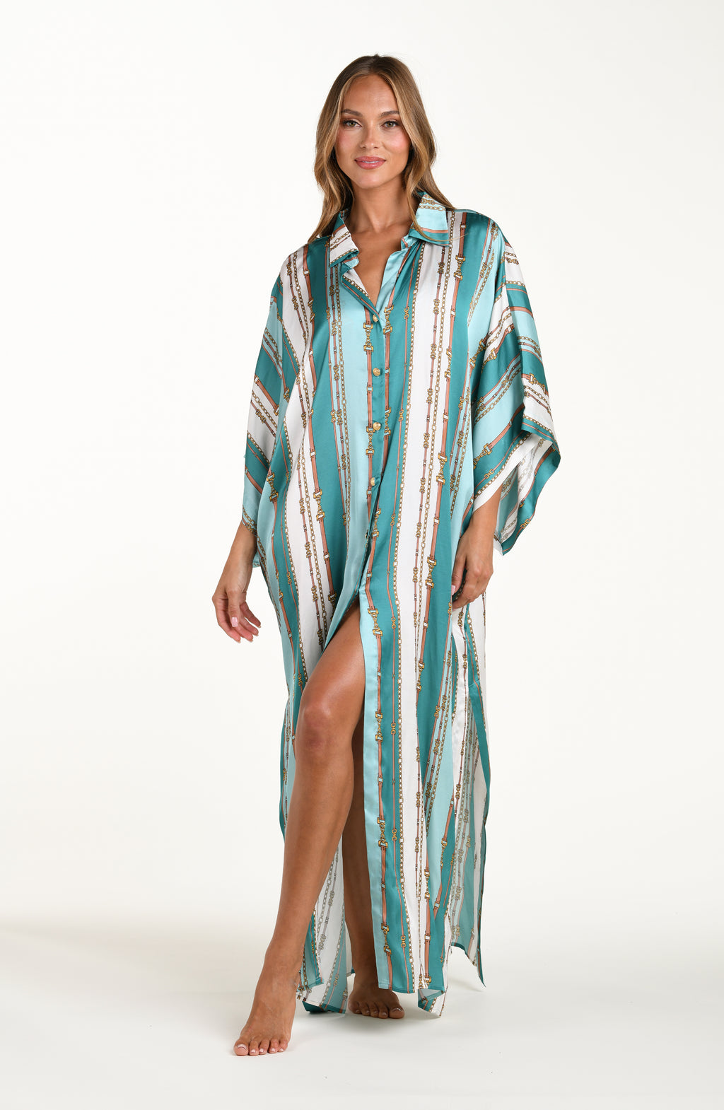 Front image of model wearing a belt-and-chain printed shirt dress cover up featuring a maxi length, gold button-down styling, with a collar and short sleeves.