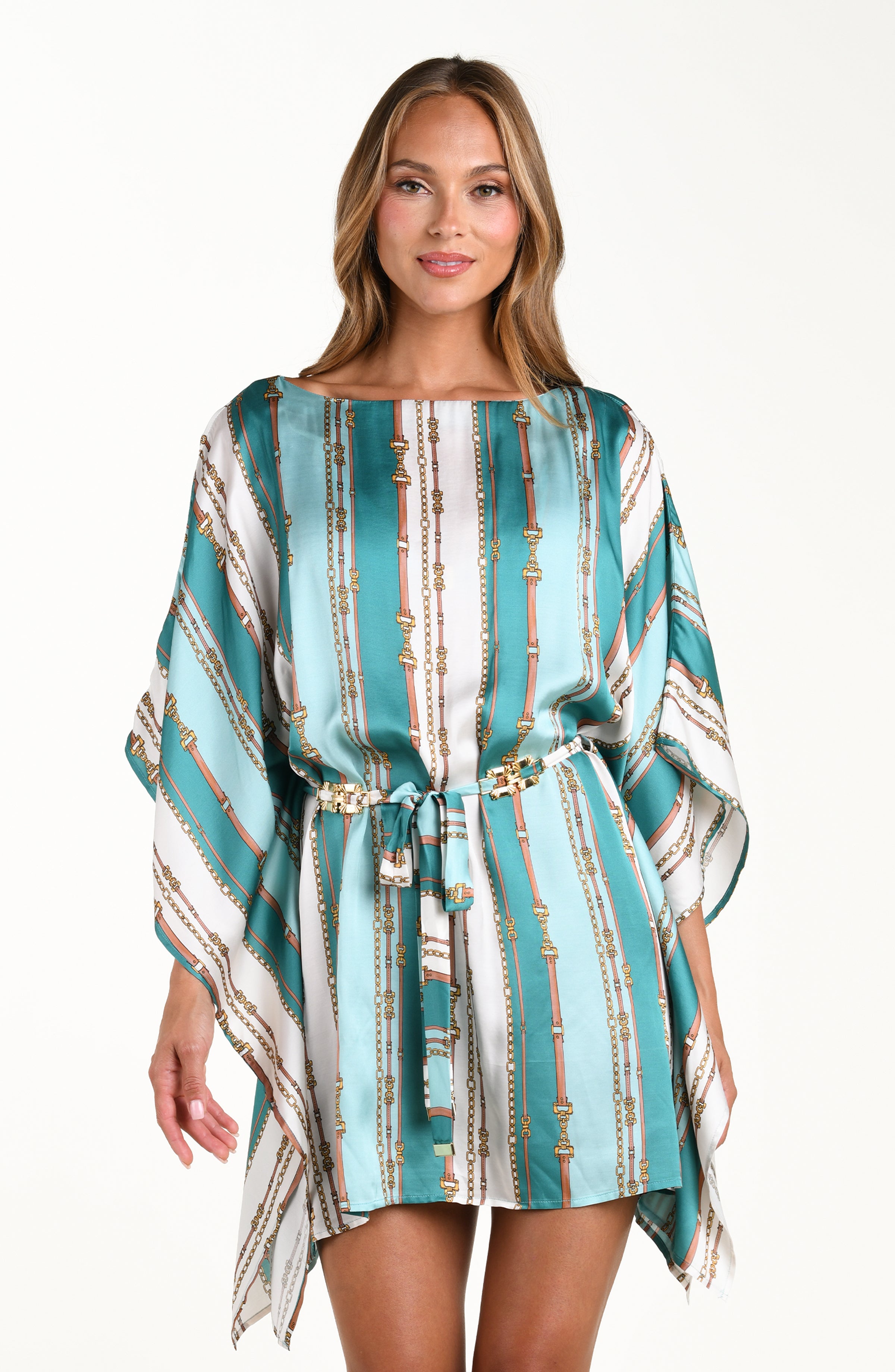 Front image of model wearing a belt-and-chain printed cover up tunic featuring a high neckline, wide sleeves, and removable belt. 