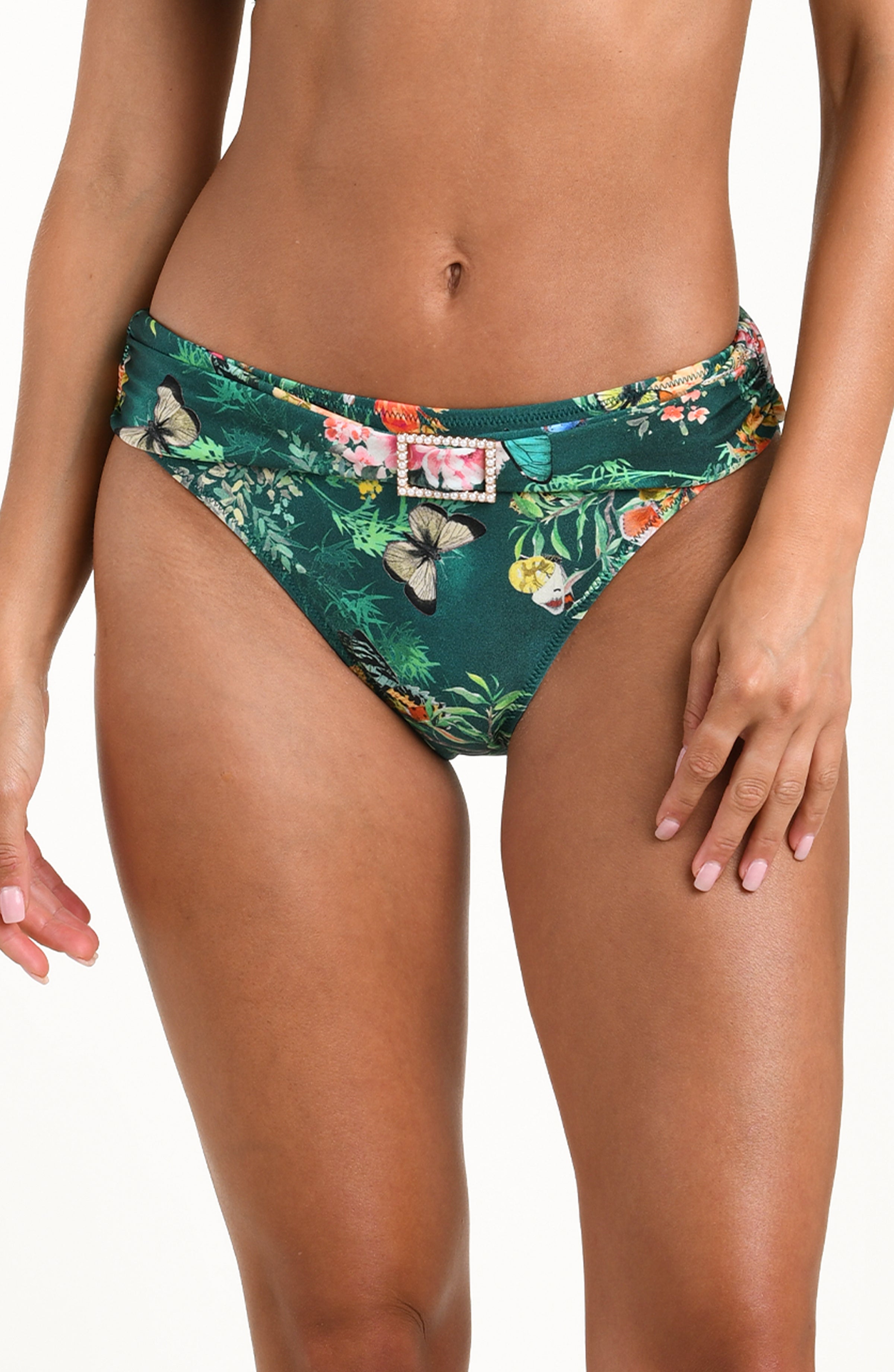 Front image of model wearing a multicolored floral printed bikini bottom featuring a mid-rise fit with a soft waistband and decorative buckle detail.
