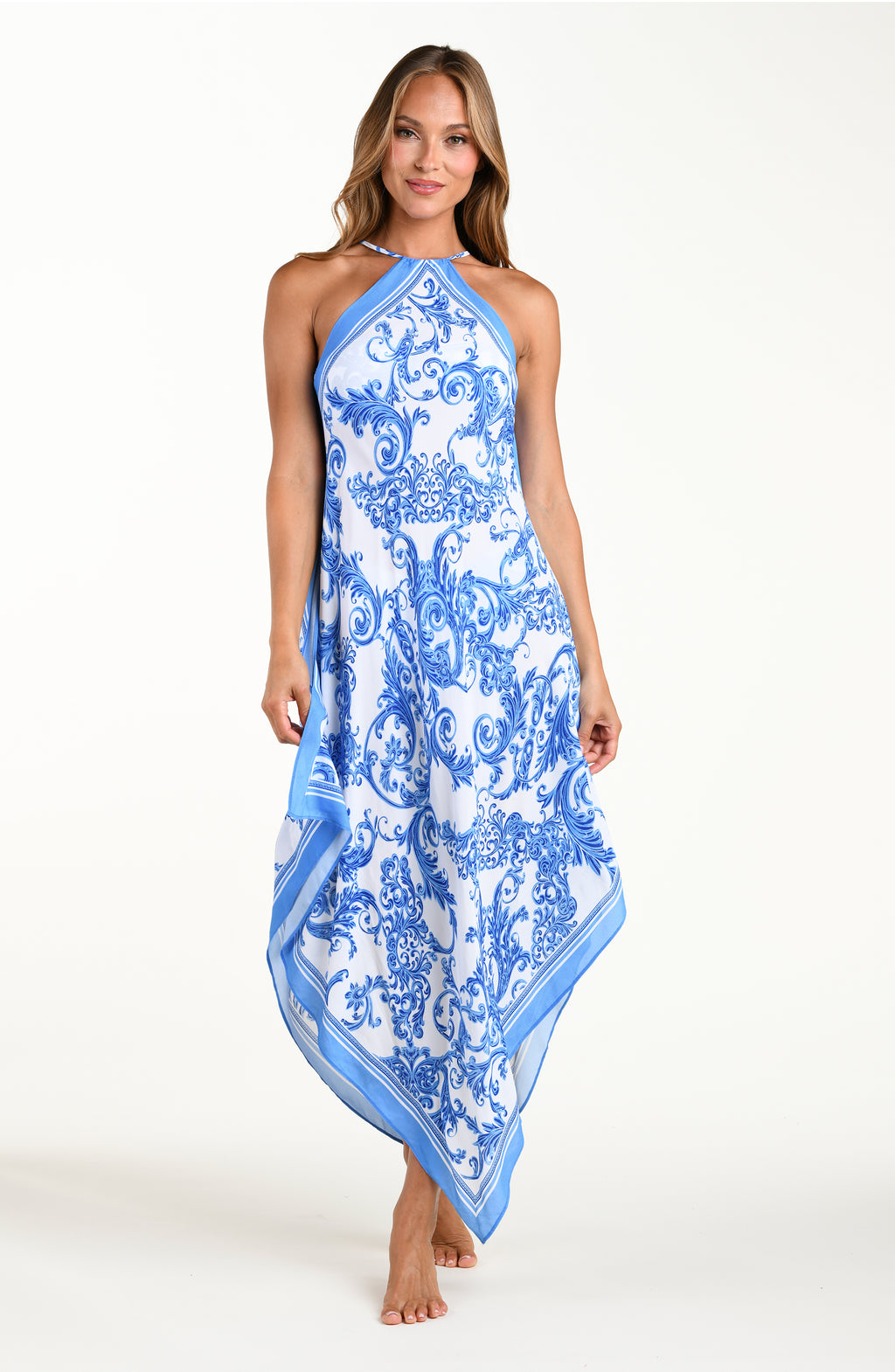 Woman wearing a blue and white patterned dress on a white background