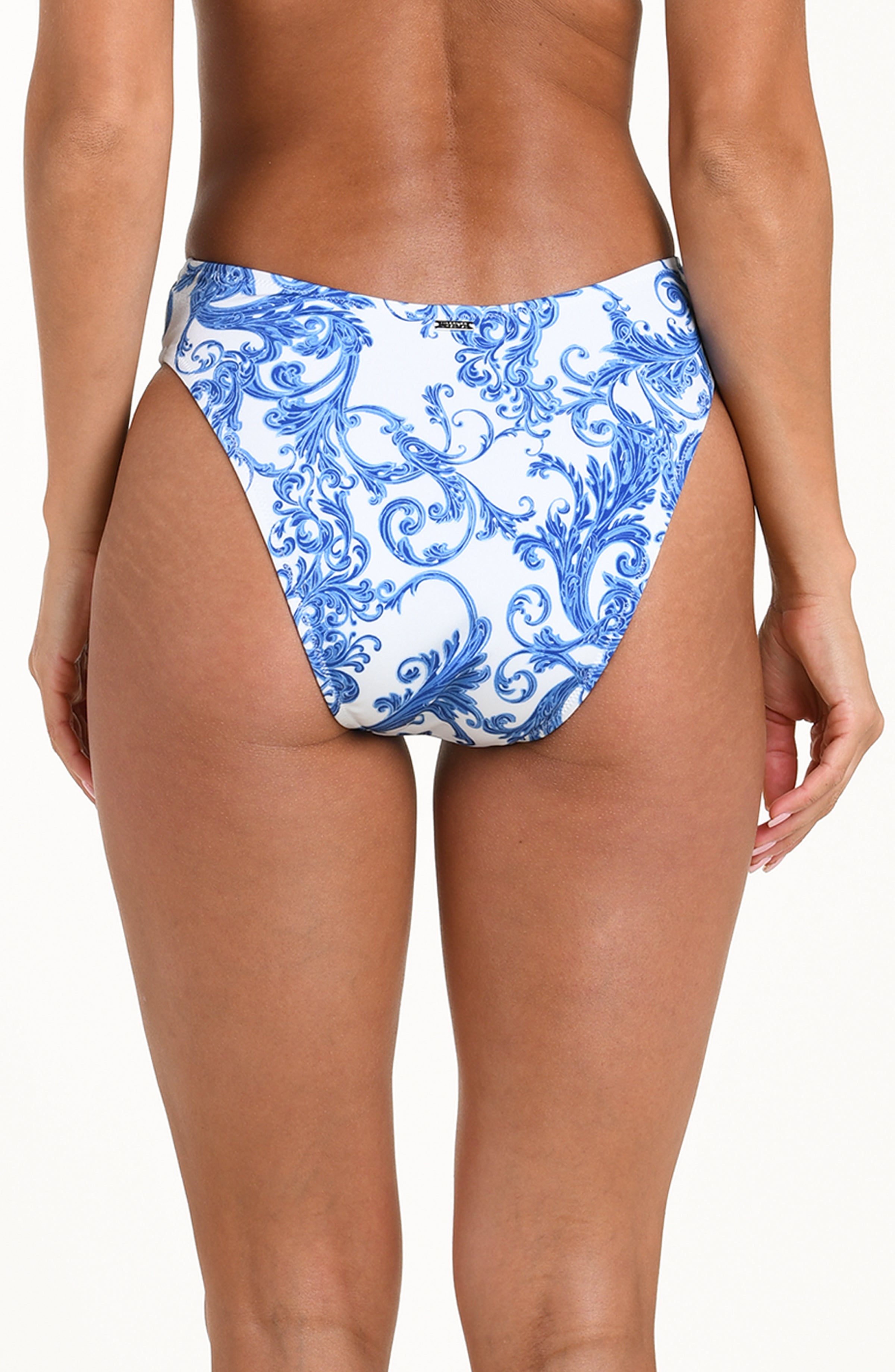 Blue and white patterned bikini bottom on a model against a white background