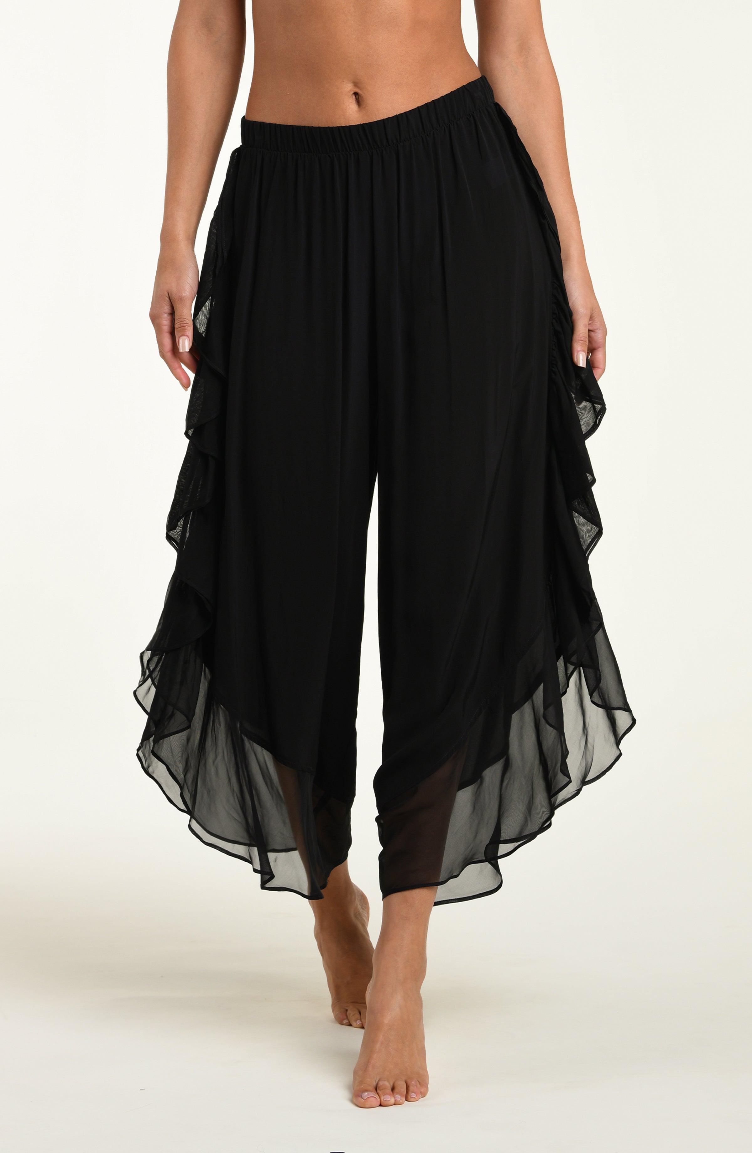 Black layered pants on a white background