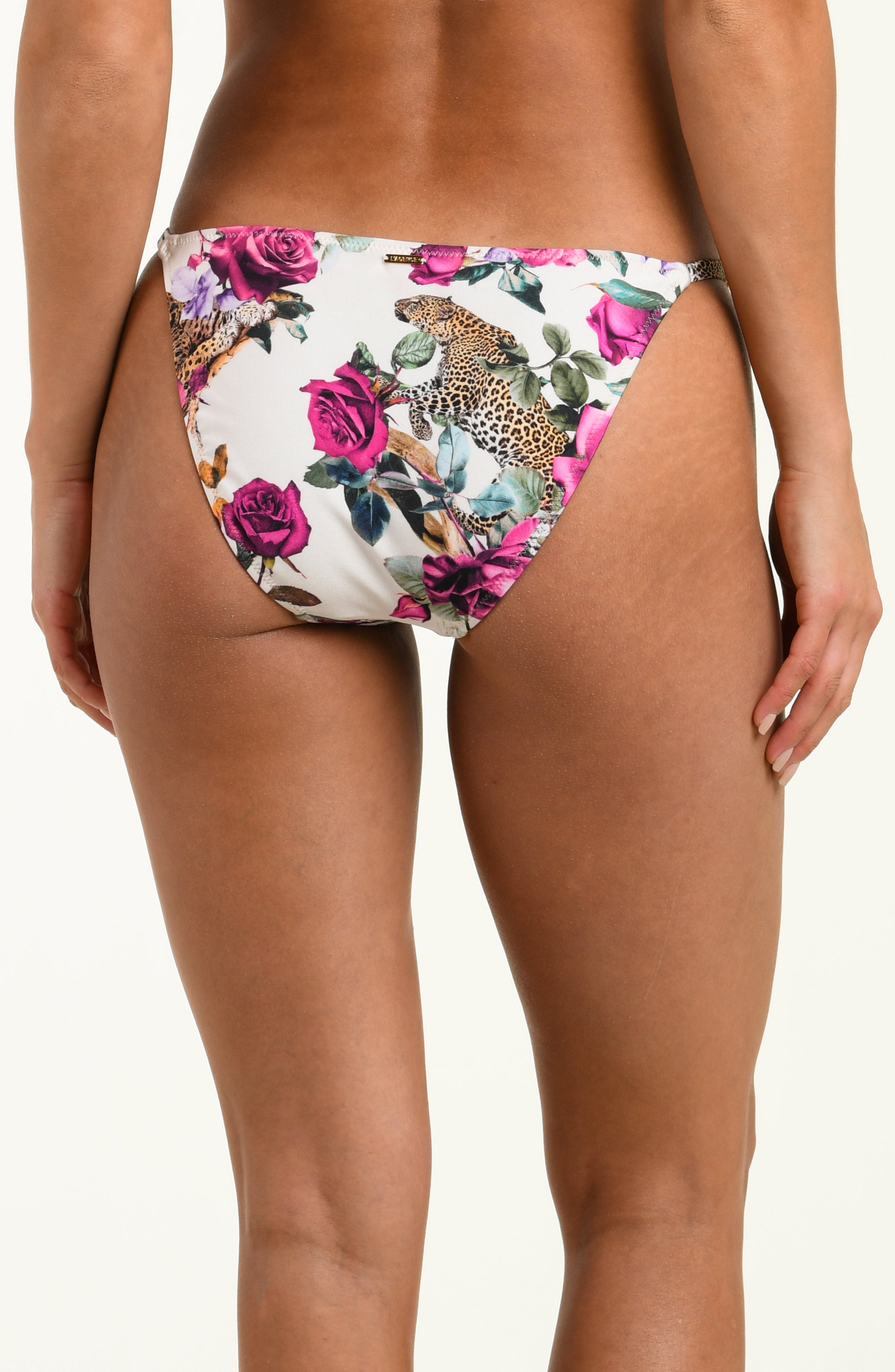 Floral and leopard print bikini bottom on a white background