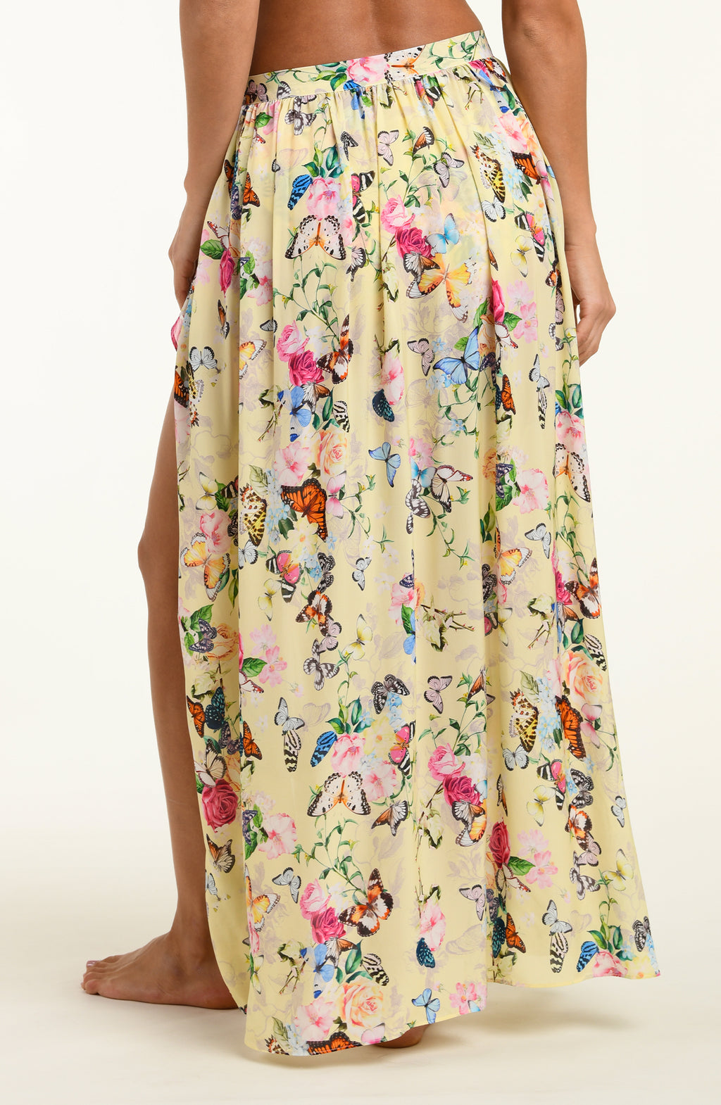 Floral and butterfly patterned skirt on a plain background