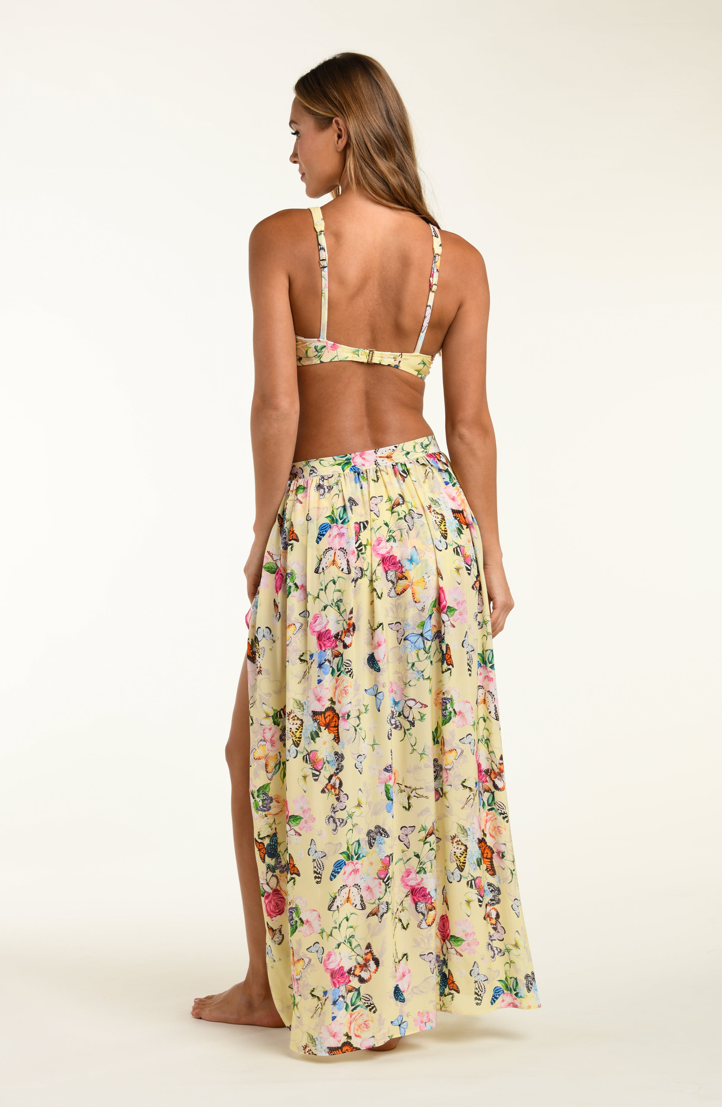 Woman wearing a floral dress with a white background