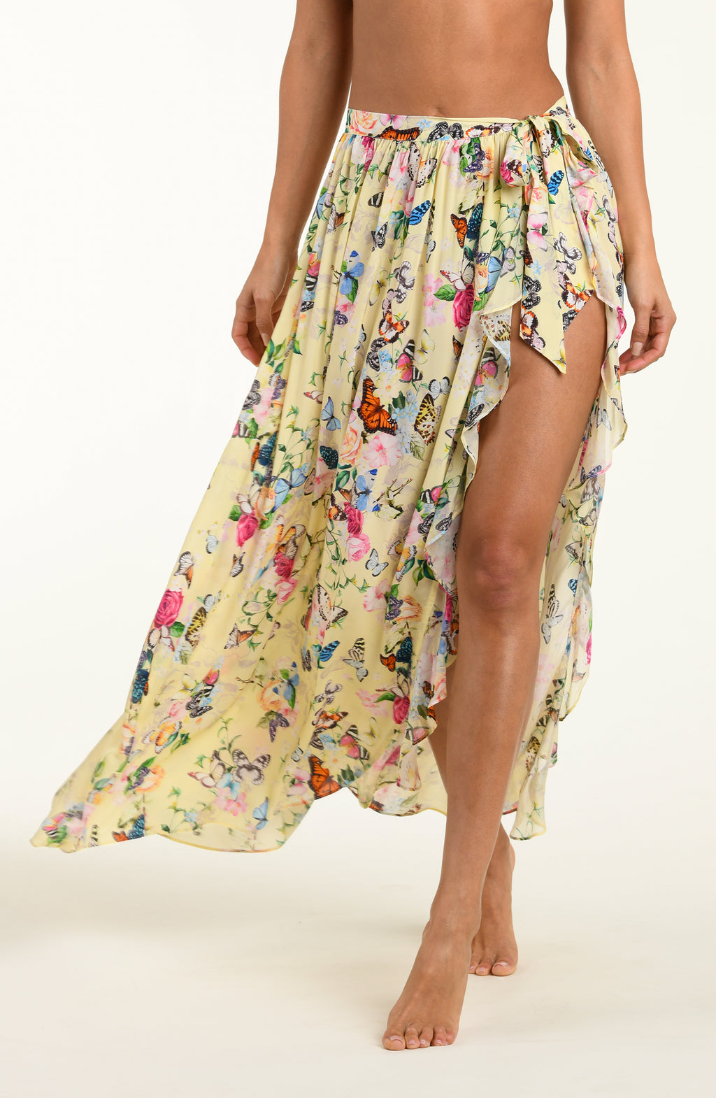Woman wearing a floral skirt with a white background