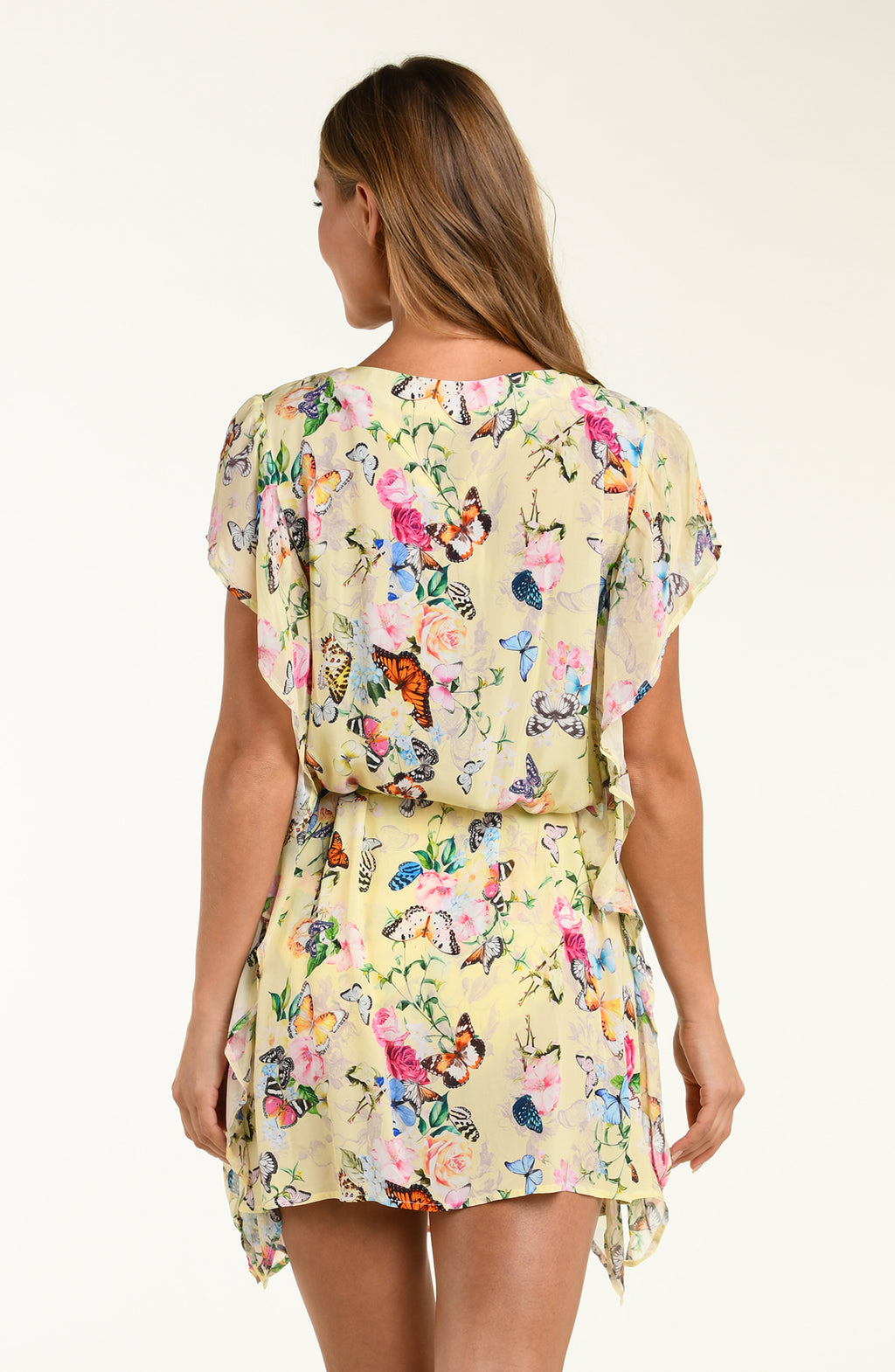 Woman wearing a floral dress with a white background