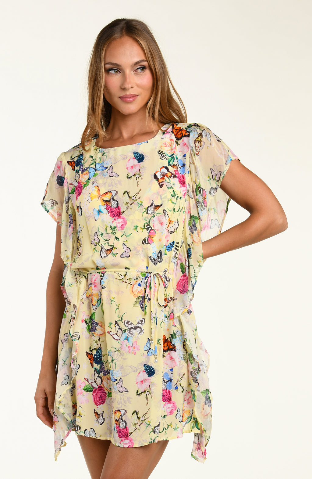 Woman wearing a floral dress with a plain background