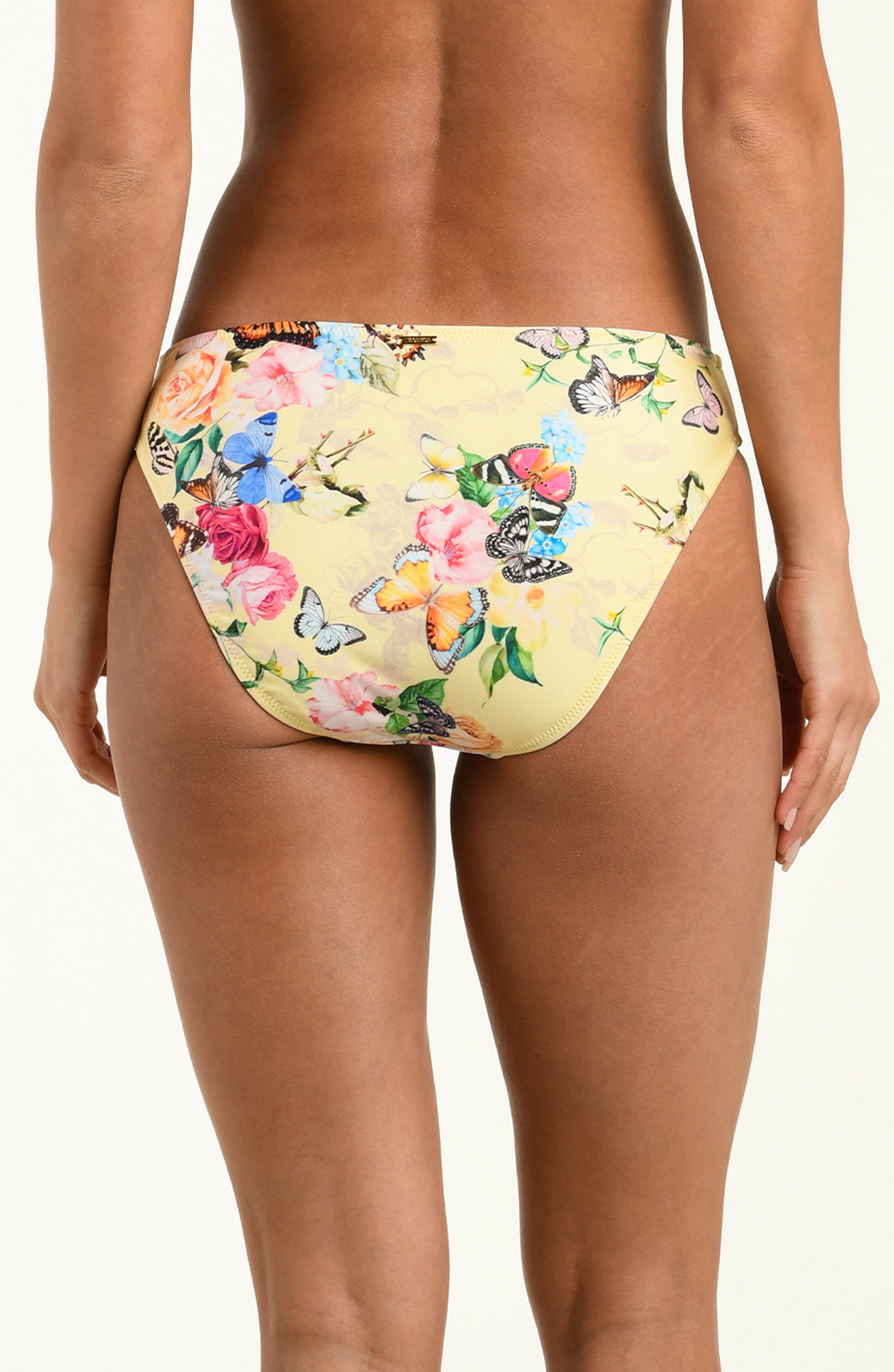 Floral and butterfly patterned bikini bottom on a white background