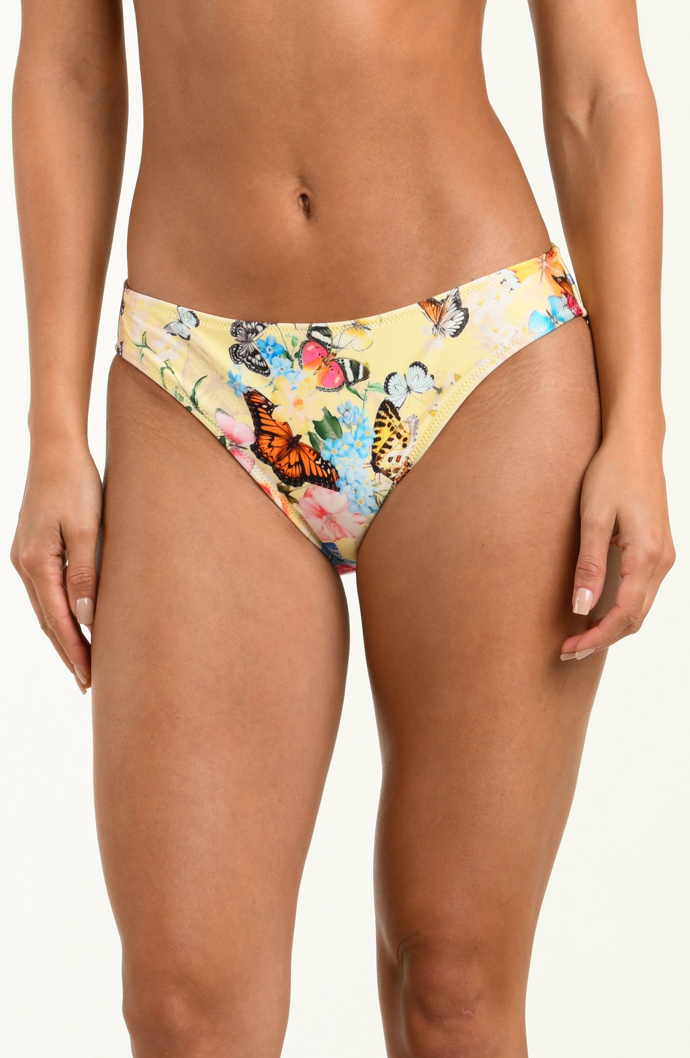 Butterfly and floral patterned bikini bottom on a plain background