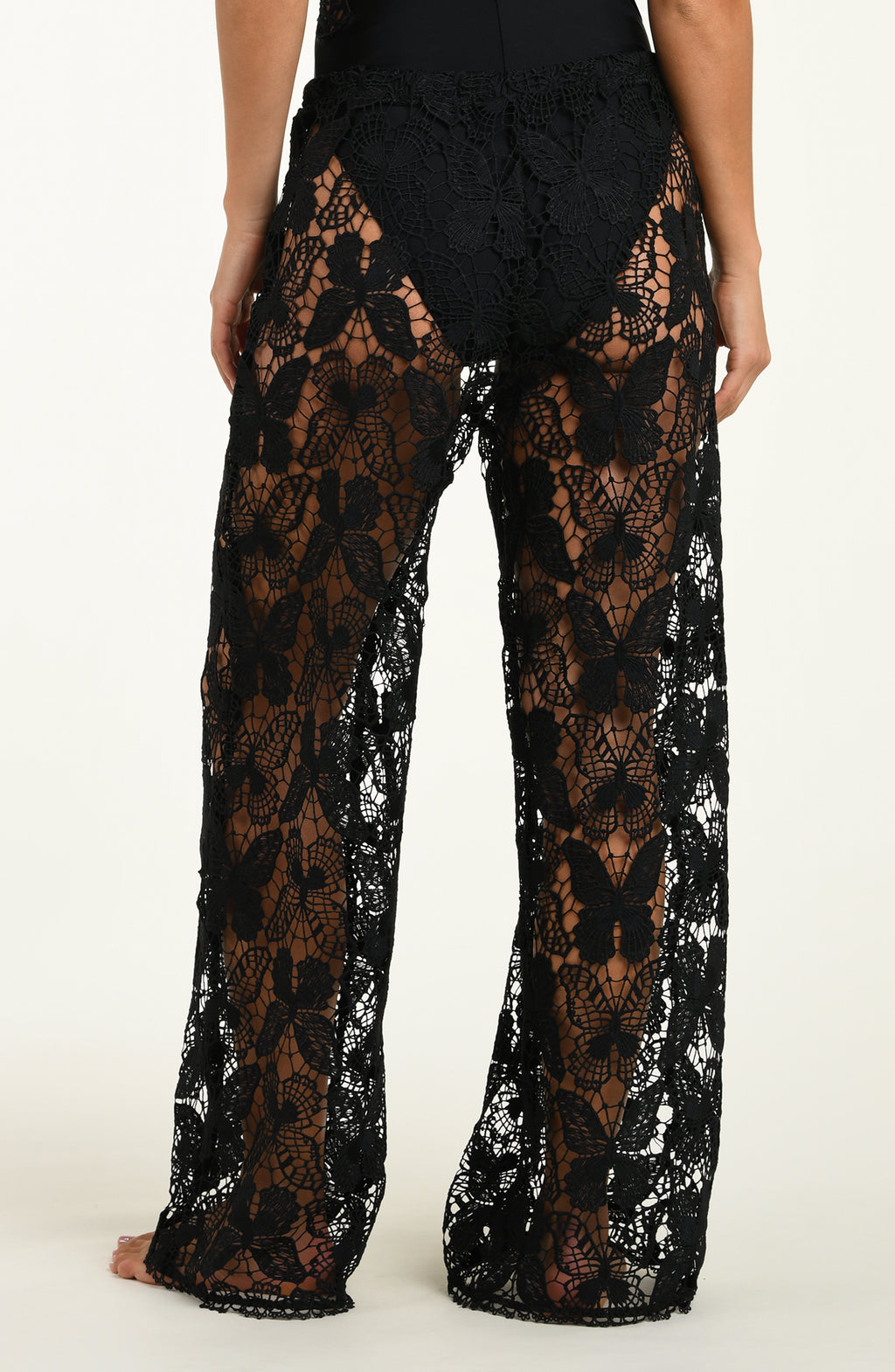 Black lace pants on a white background