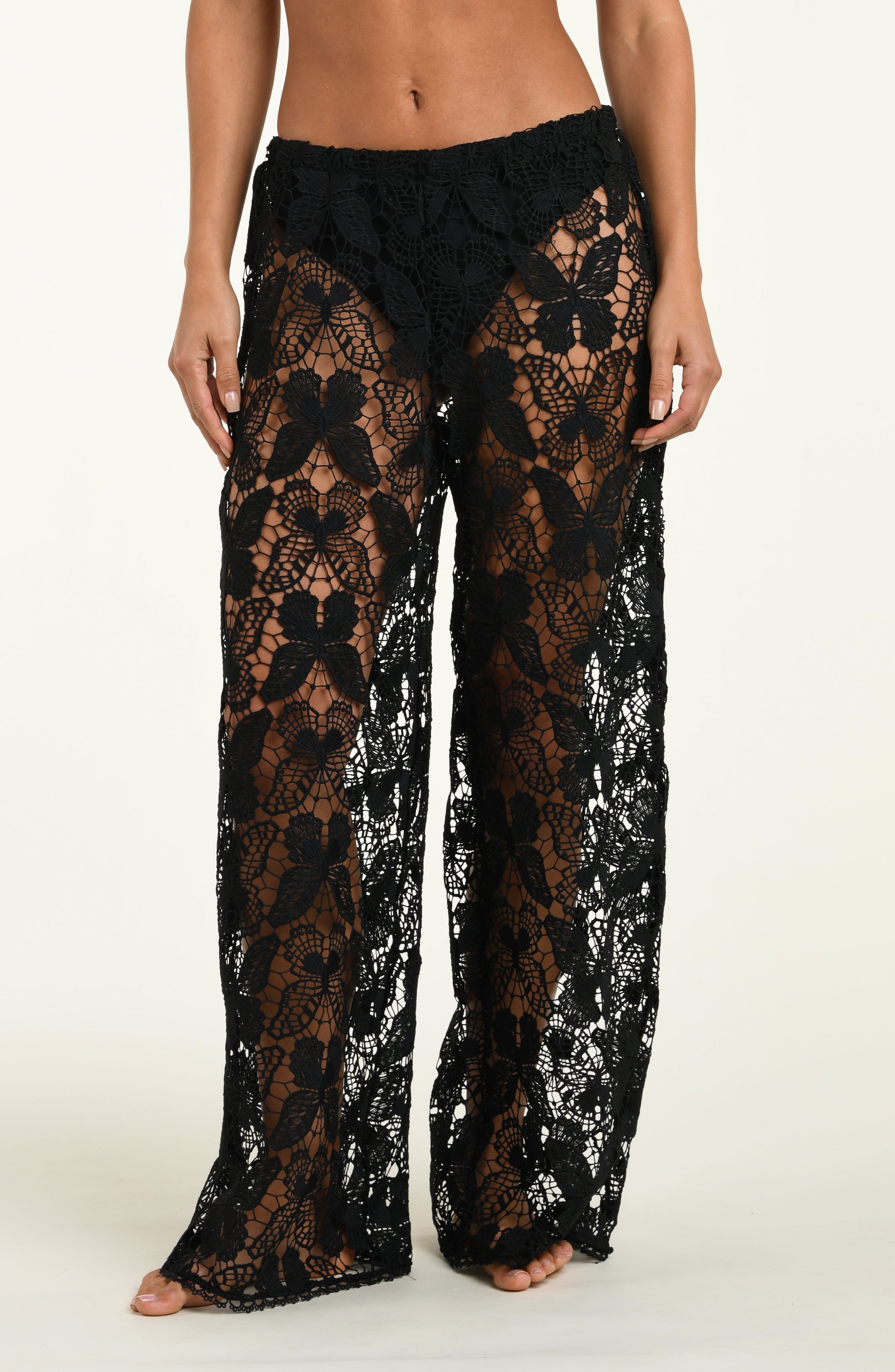 Black lace pants on a plain background