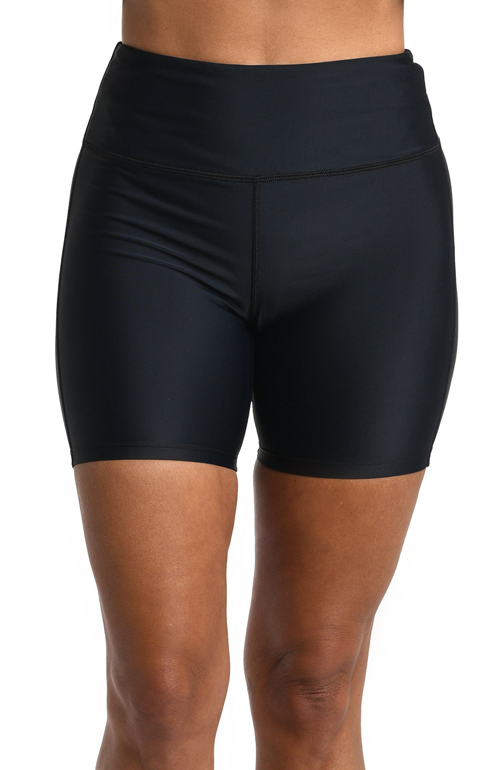 Black bike shorts worn by a person on a white background