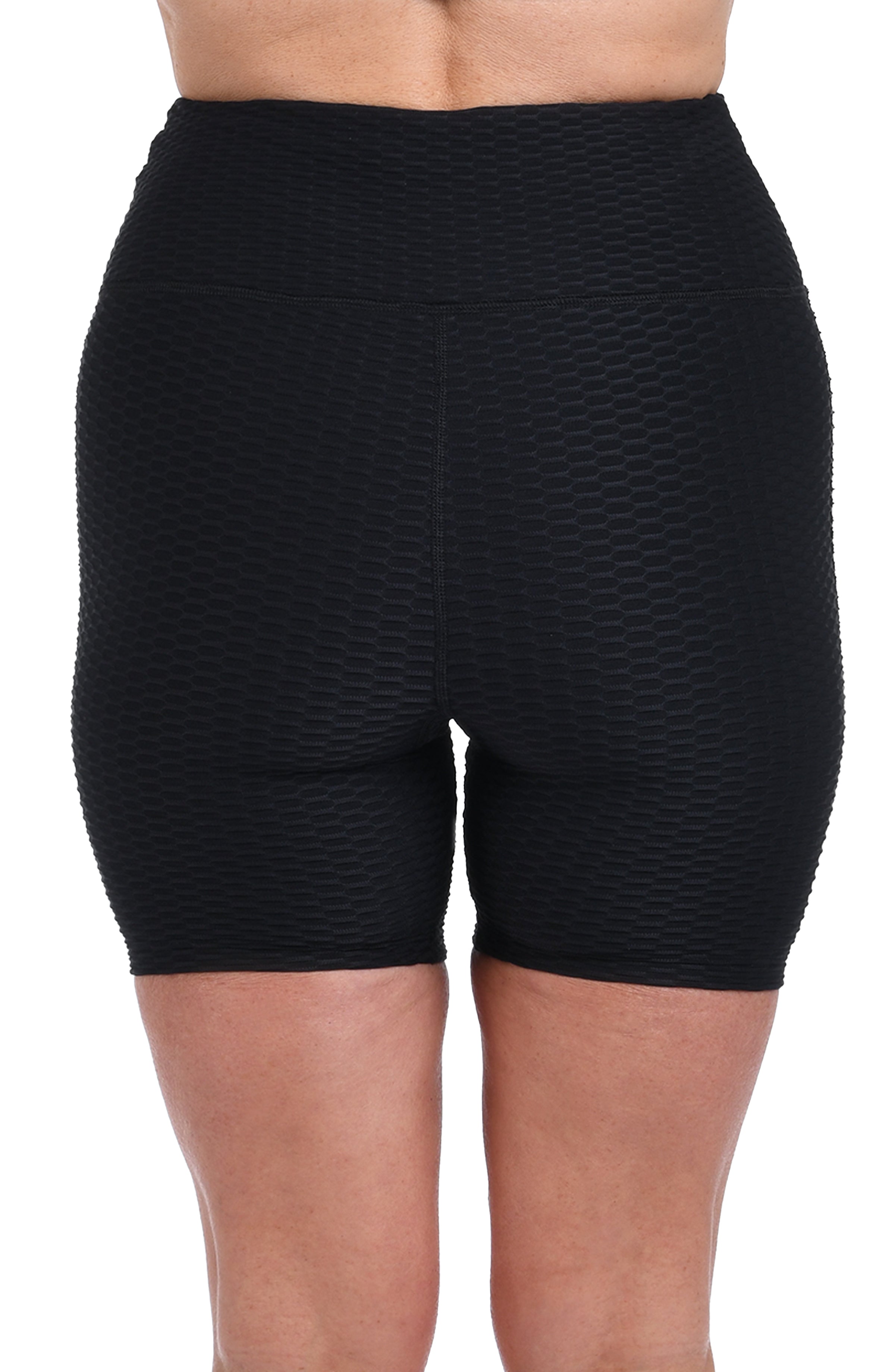 Black textured biker shorts on a white background