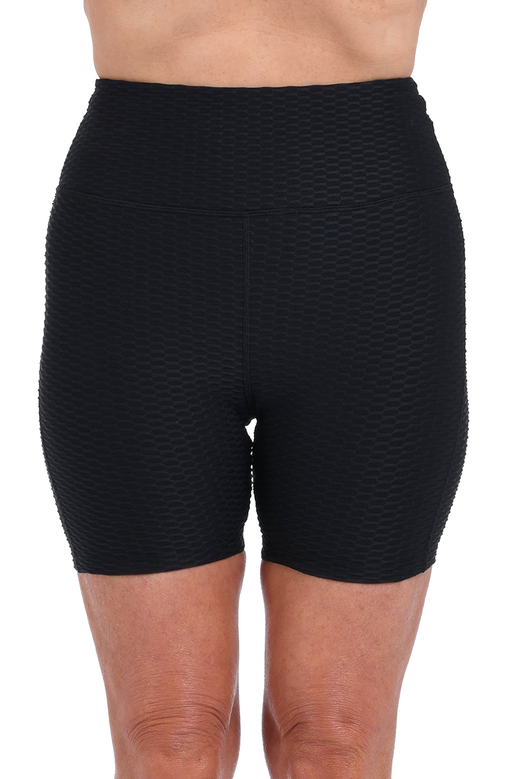 Black textured biker shorts worn by a person on a white background