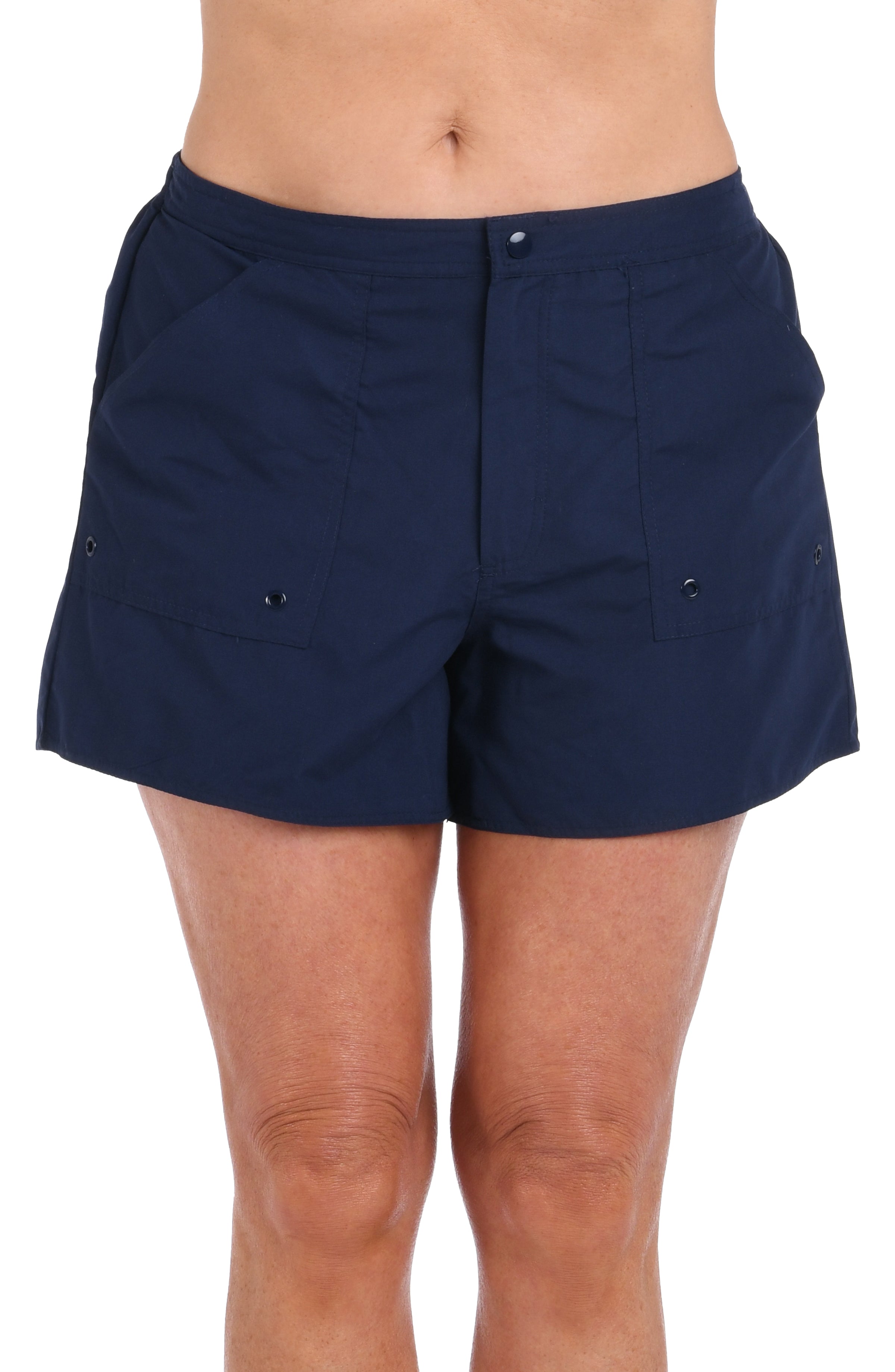 Navy blue shorts worn by a person on a white background