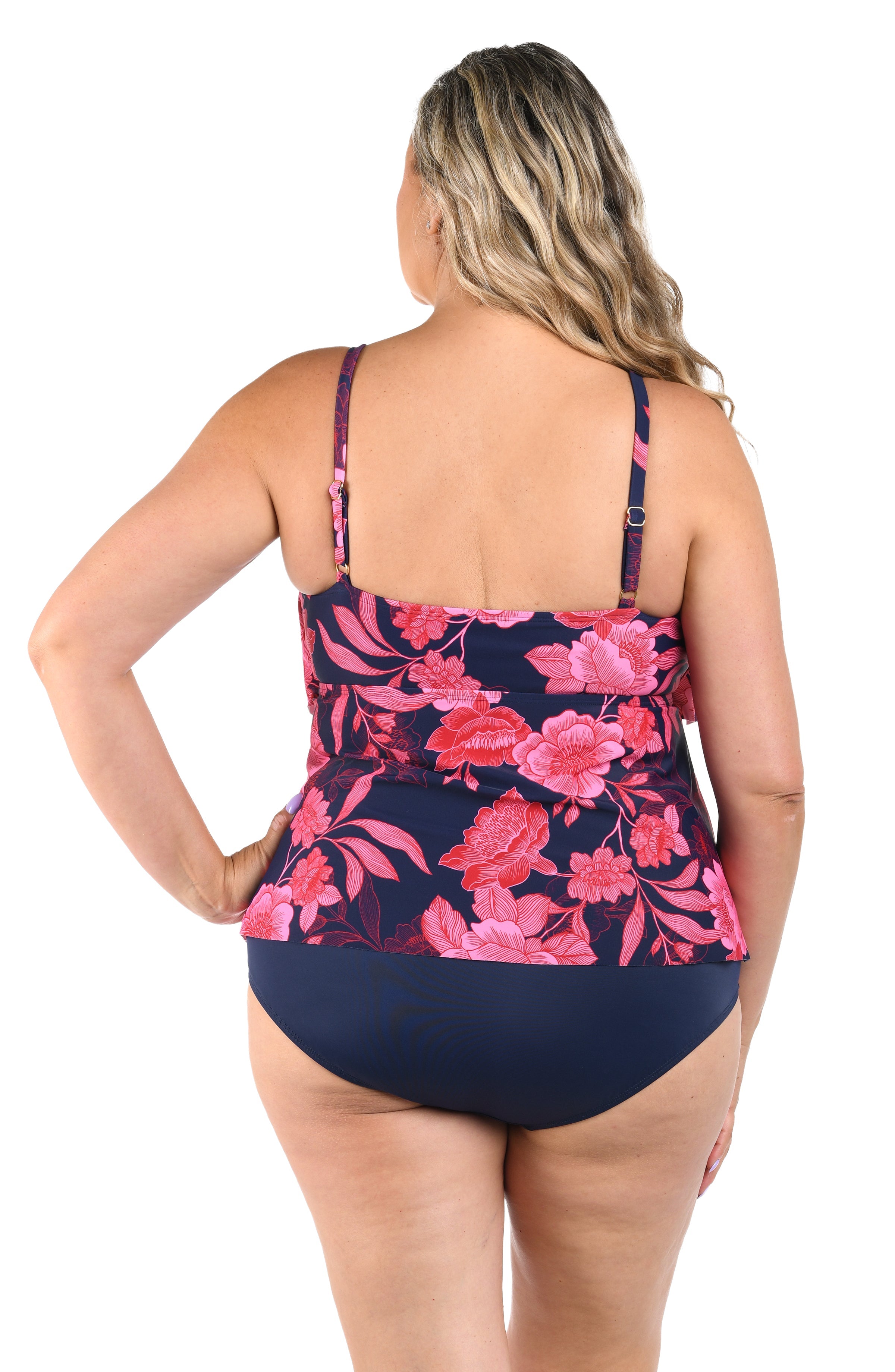 Woman wearing a floral swimsuit with a white background