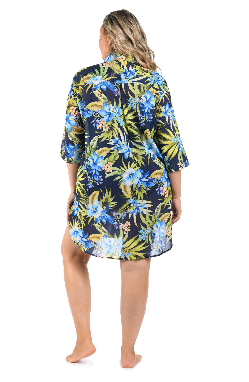 Woman wearing a floral patterned nightshirt on a white background