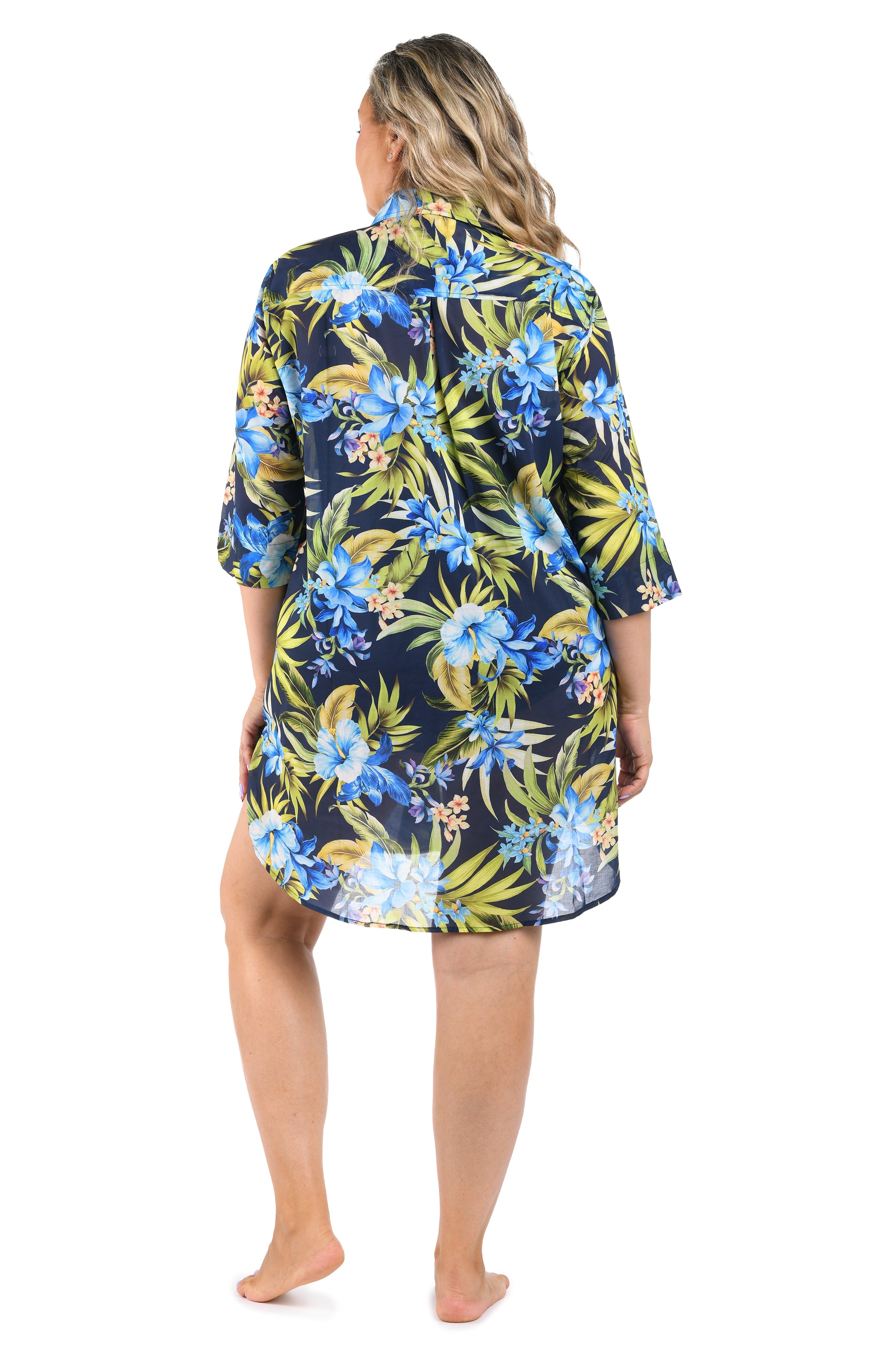 Woman wearing a floral patterned nightshirt on a white background