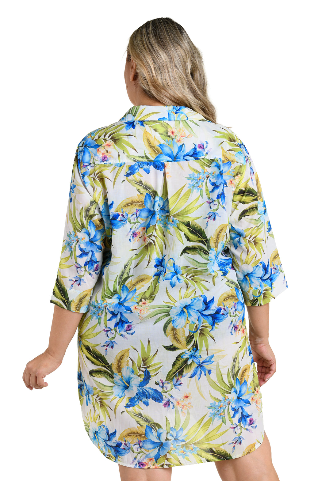 Woman wearing a floral cover up shirt with blue flowers on a white background