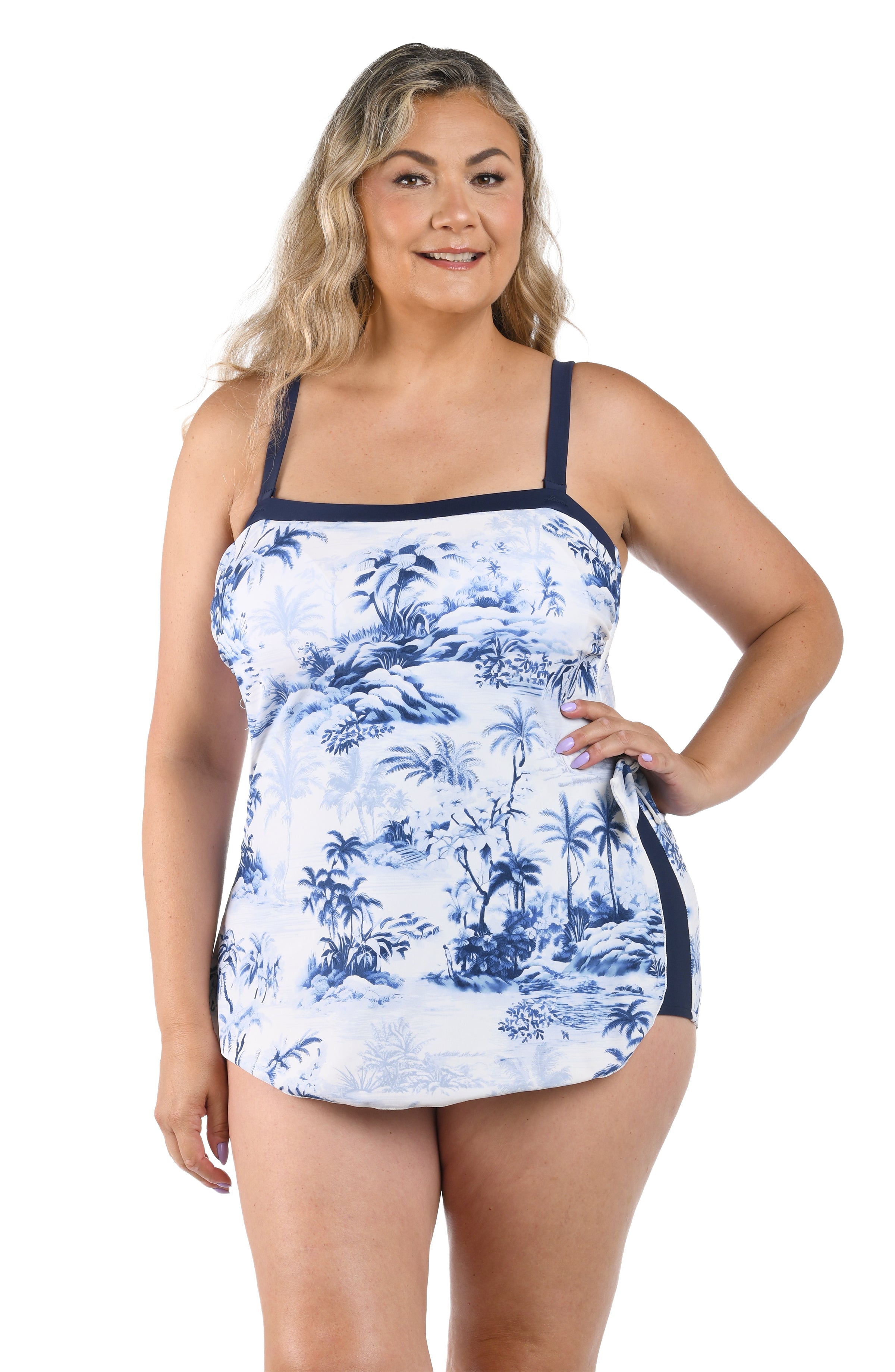 Woman wearing a blue and white floral tankini on a white background