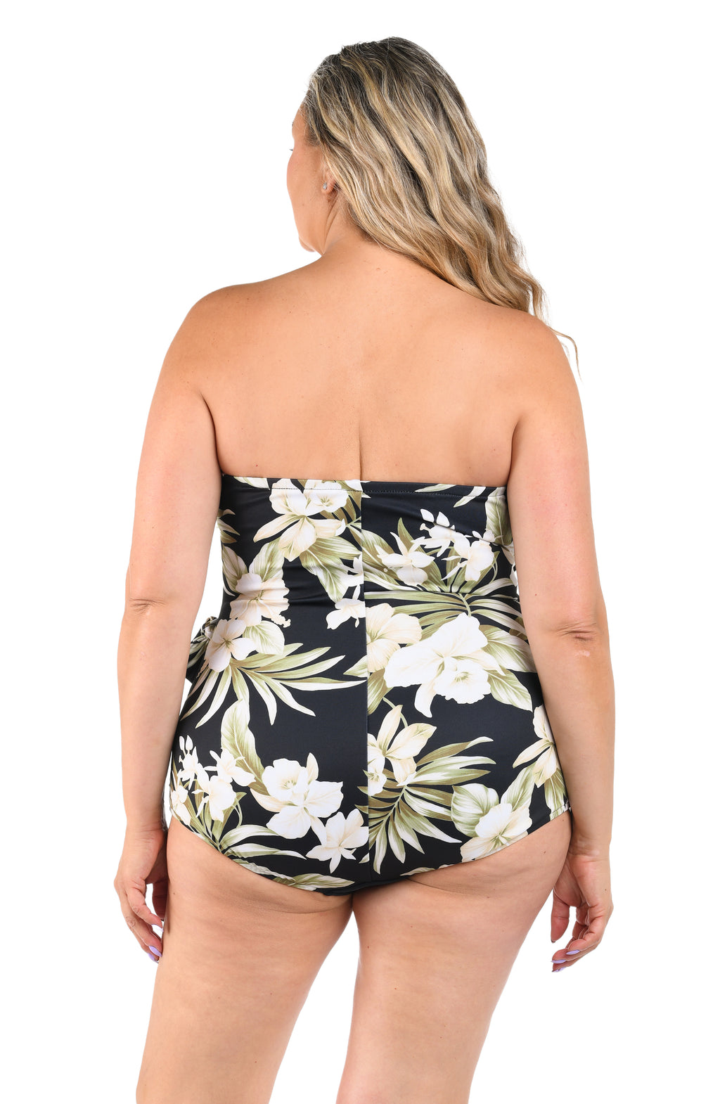 Woman wearing a strapless floral swimsuit on a white background