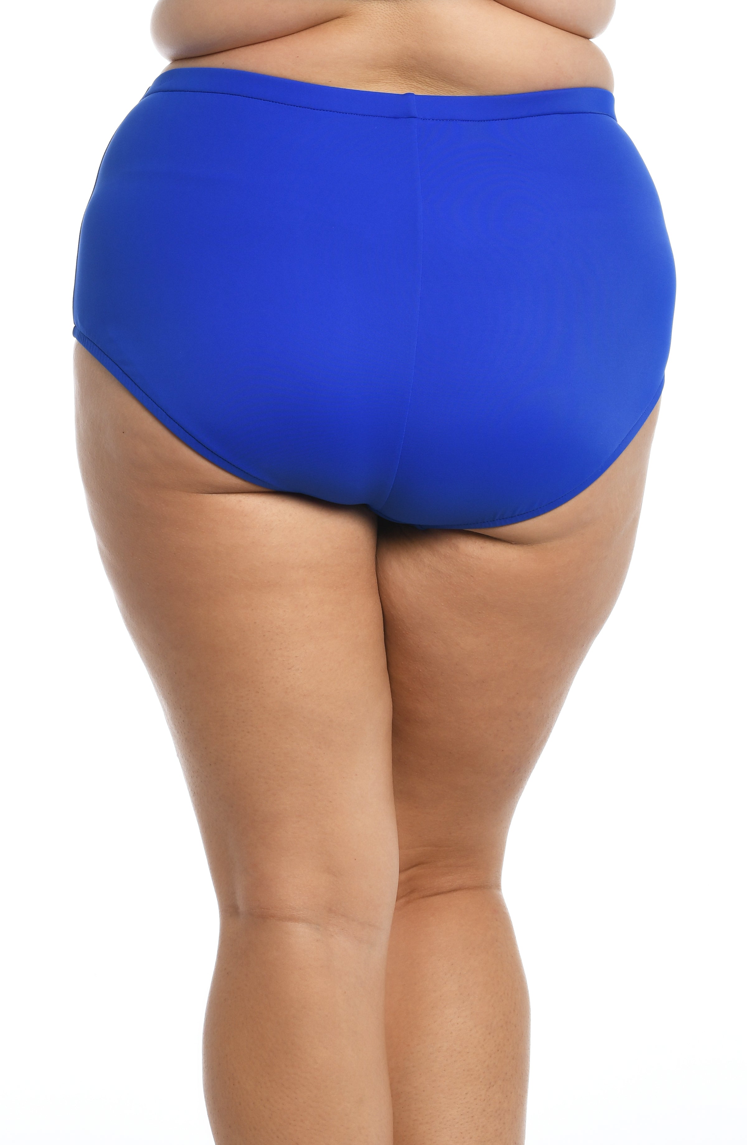 Blue mid waisted bottoms against a white background. 