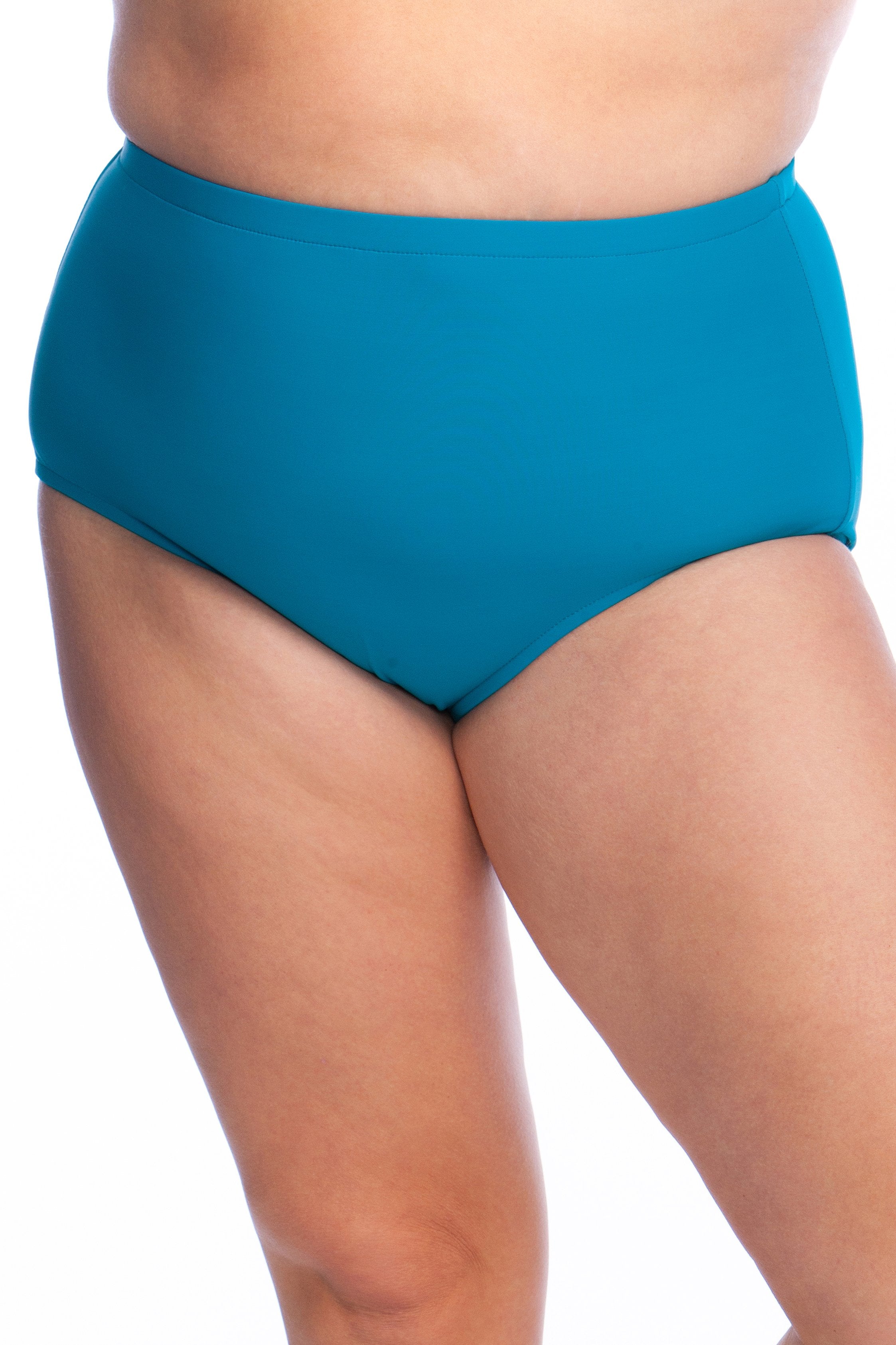 Emerald colored high waisted swim bottoms against a white background. 