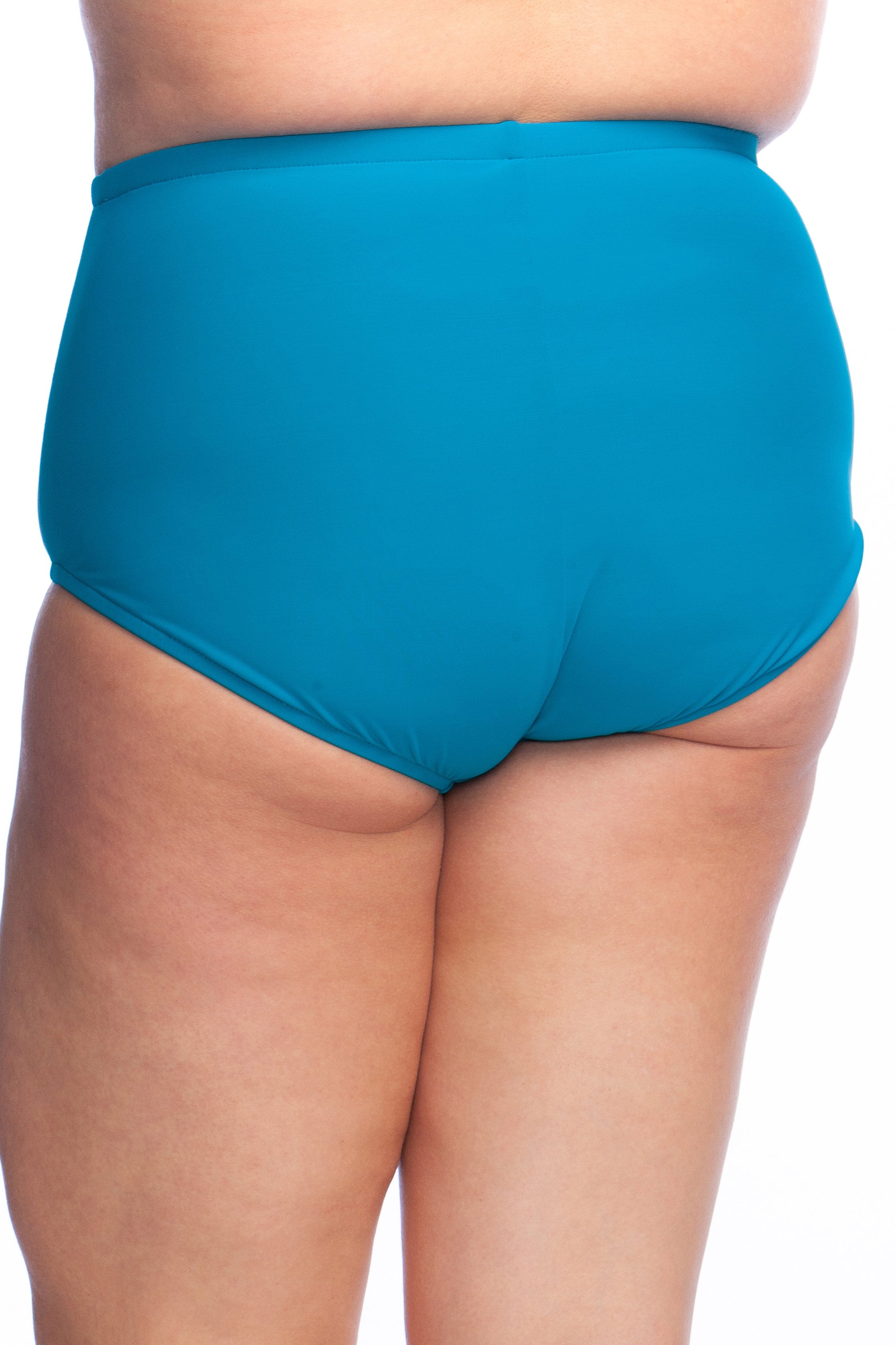Emerald colored high waisted swim bottoms against a white background. 