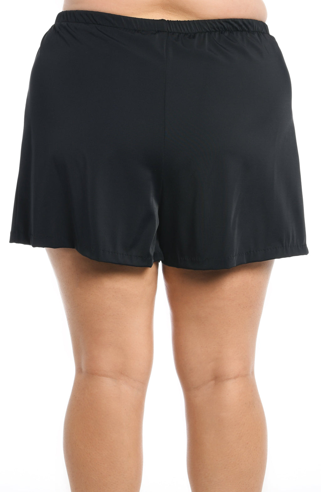 Woman wearing a black swim short against a white background