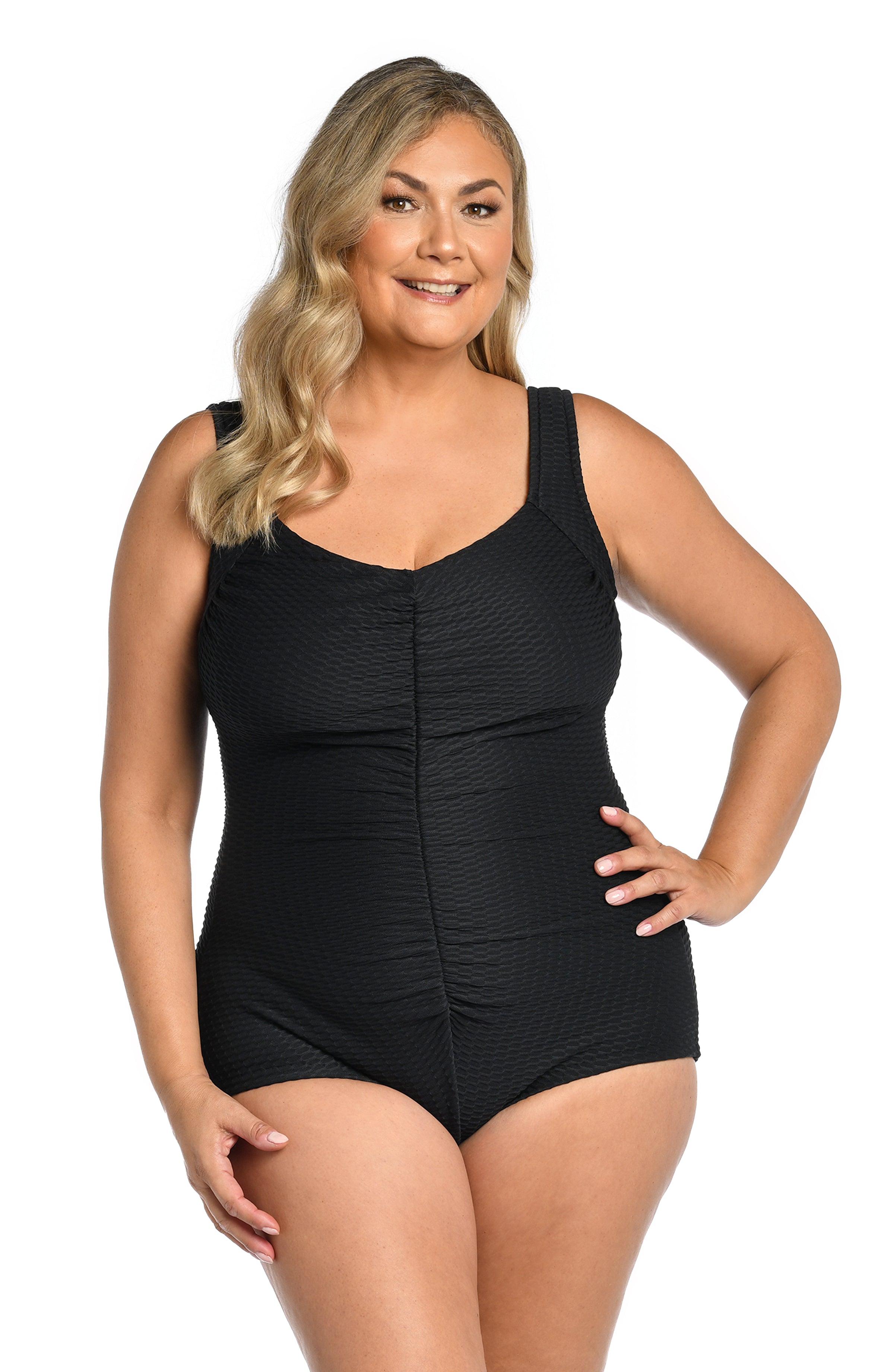 Woman wearing a black swimsuit on a white background
