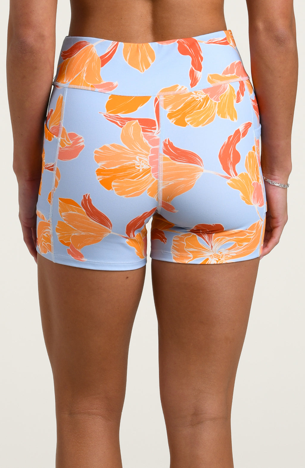 Floral patterned shorts on a plain background