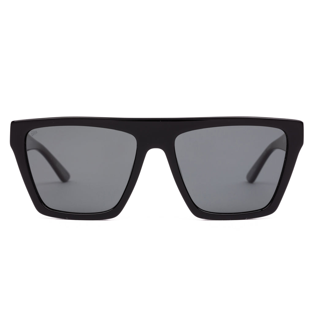 Black sunglasses with dark lenses on a white background