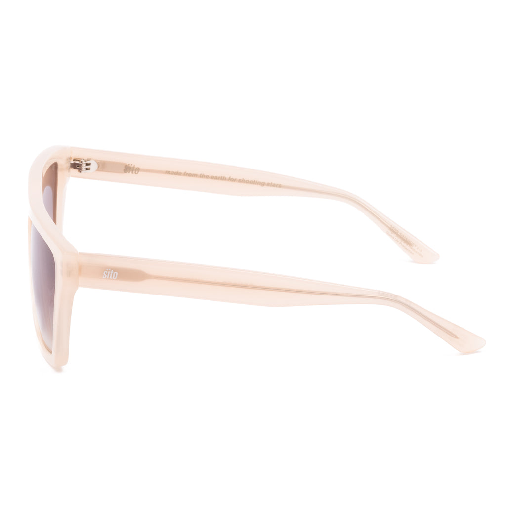 Beige sunglasses with gradient lenses on a white background