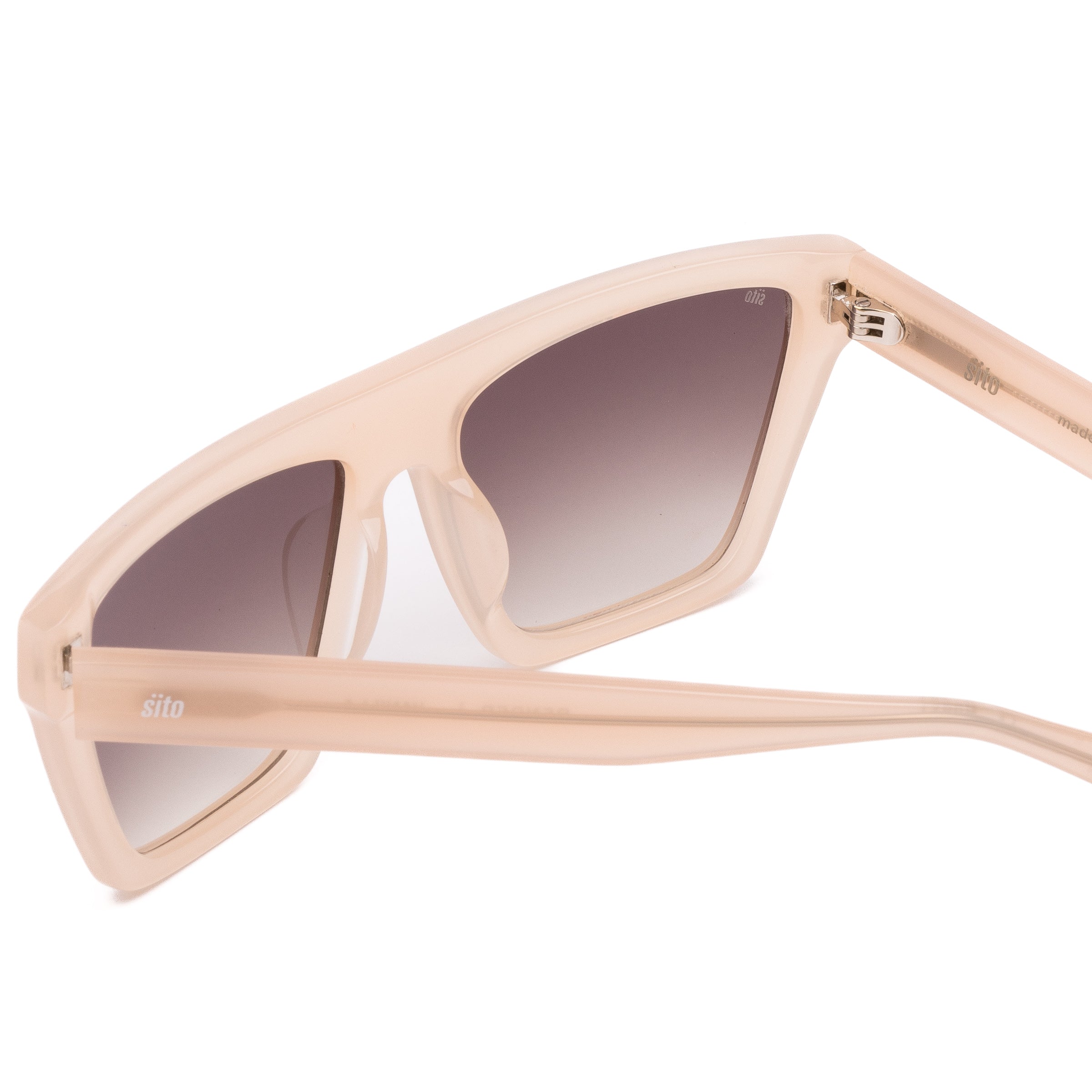 Beige sunglasses with gradient lenses on a white background