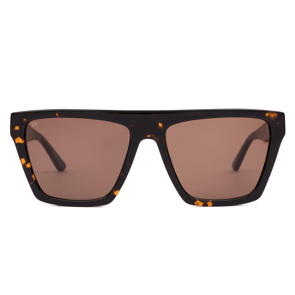 Sunglasses with tortoiseshell frame and brown lenses on a white background