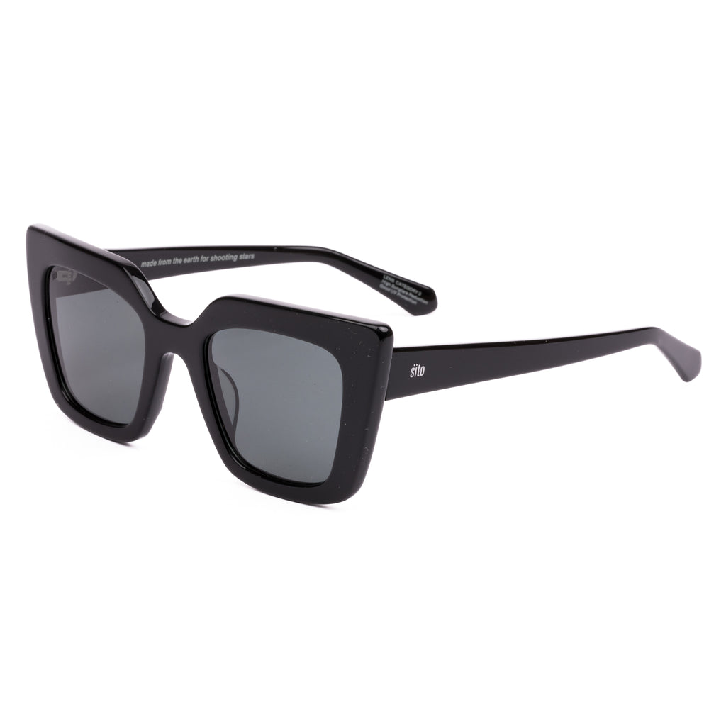 Black sunglasses with dark lenses on a white background