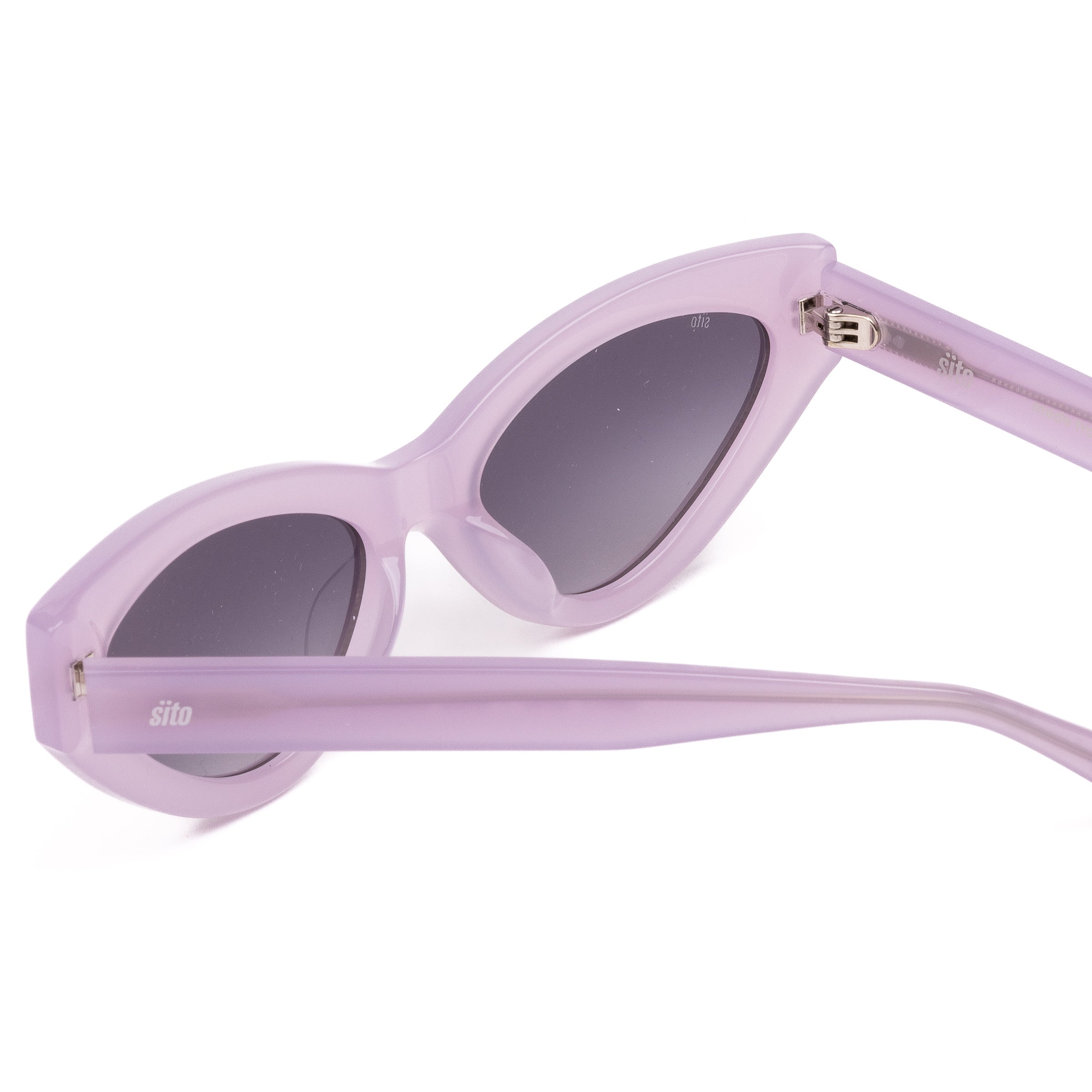 Pink cat-eye sunglasses with gray lenses on a white background