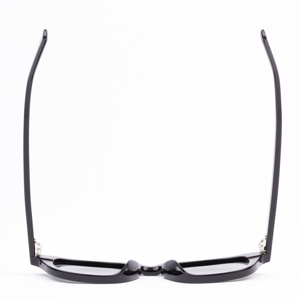 Black sunglasses with reflective lenses on a white background