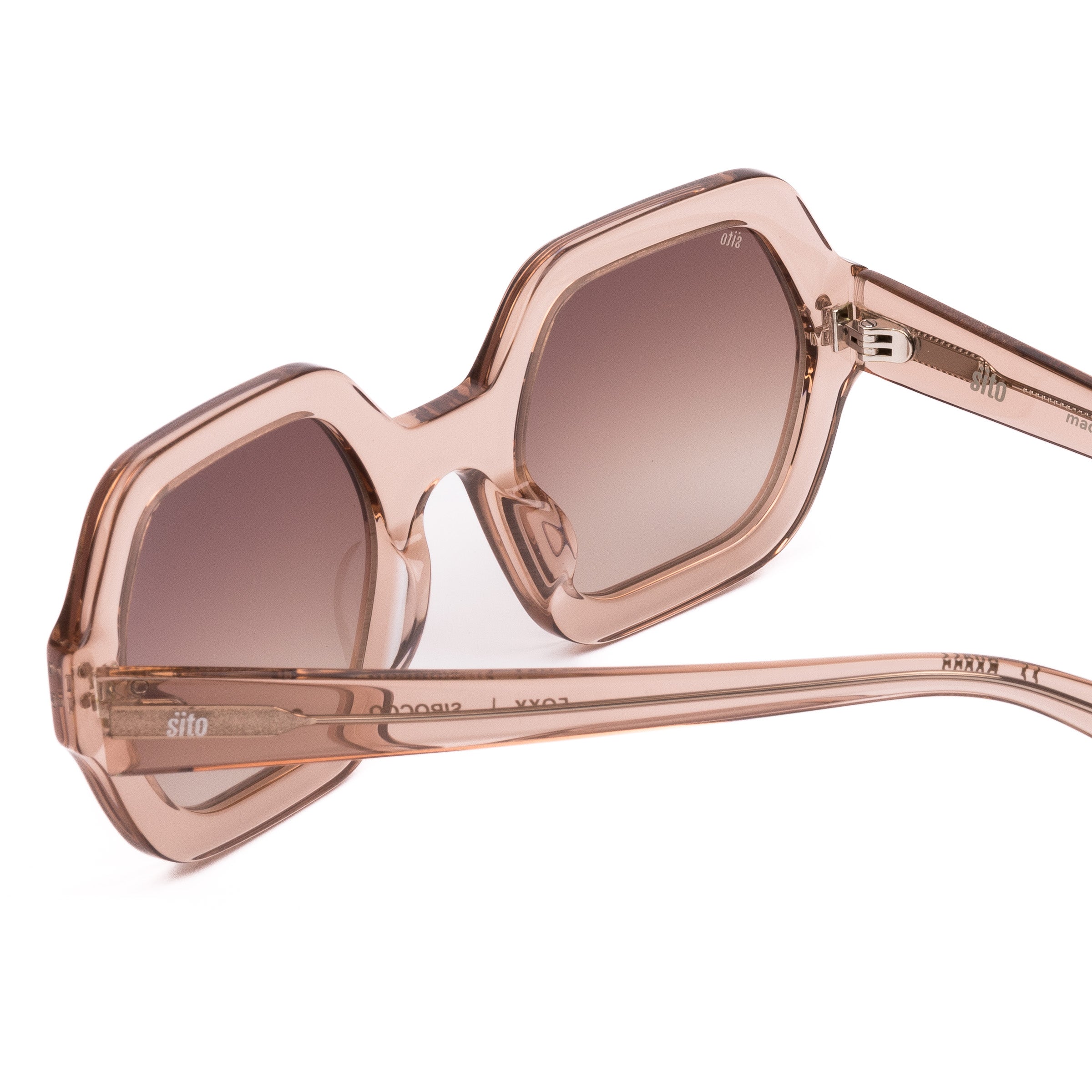 Pink sunglasses with gradient lenses on a white background