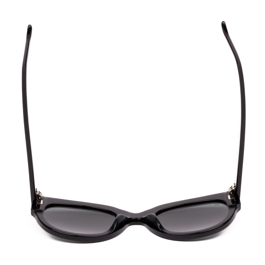 Black sunglasses with dark lenses on a white background