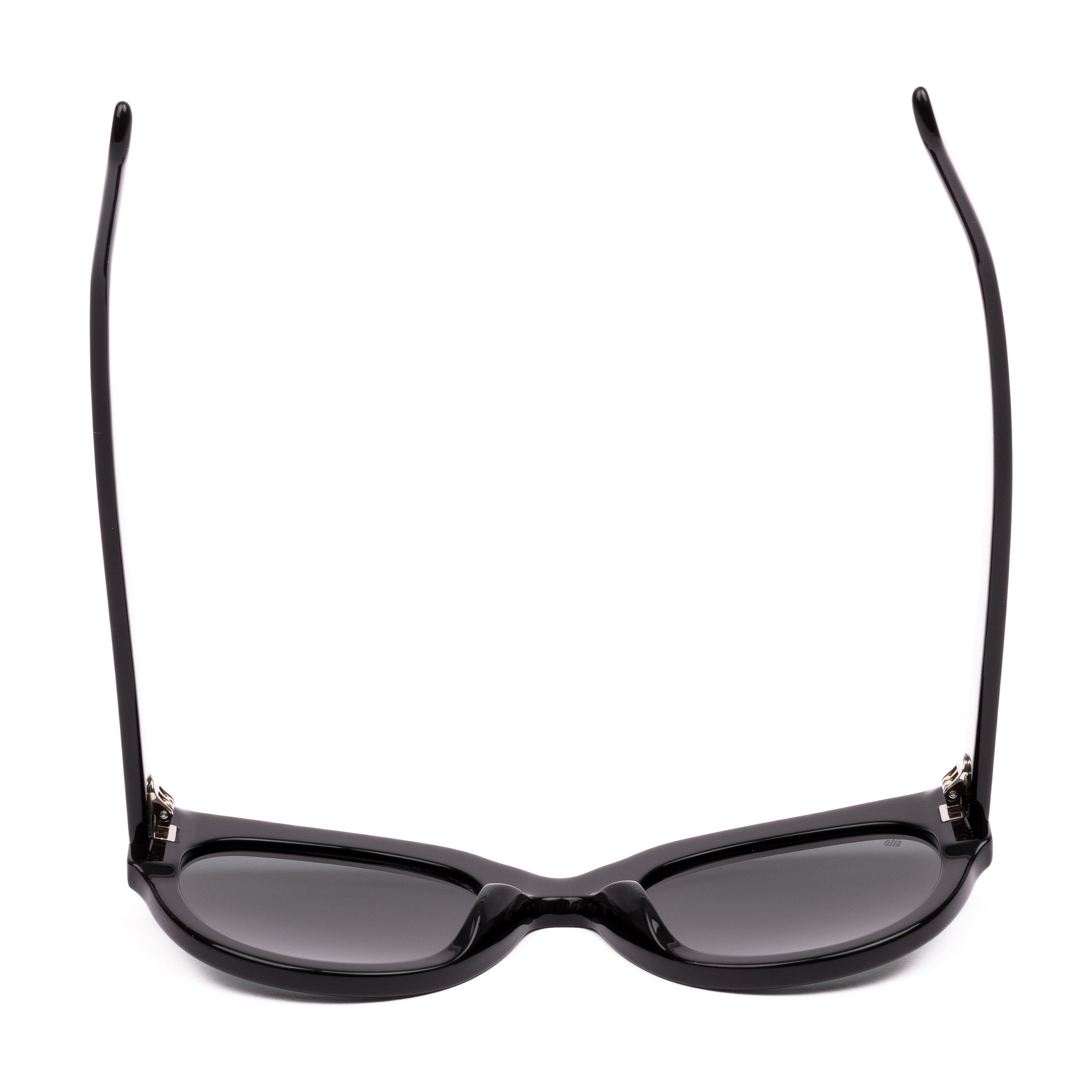 Black sunglasses with dark lenses on a white background