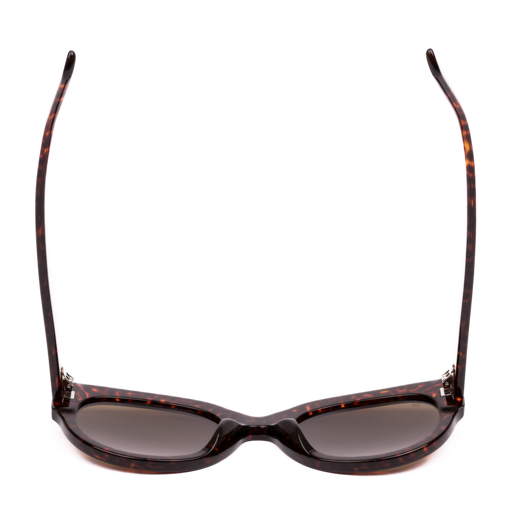 Sunglasses with tortoiseshell frame and brown lenses on a white background