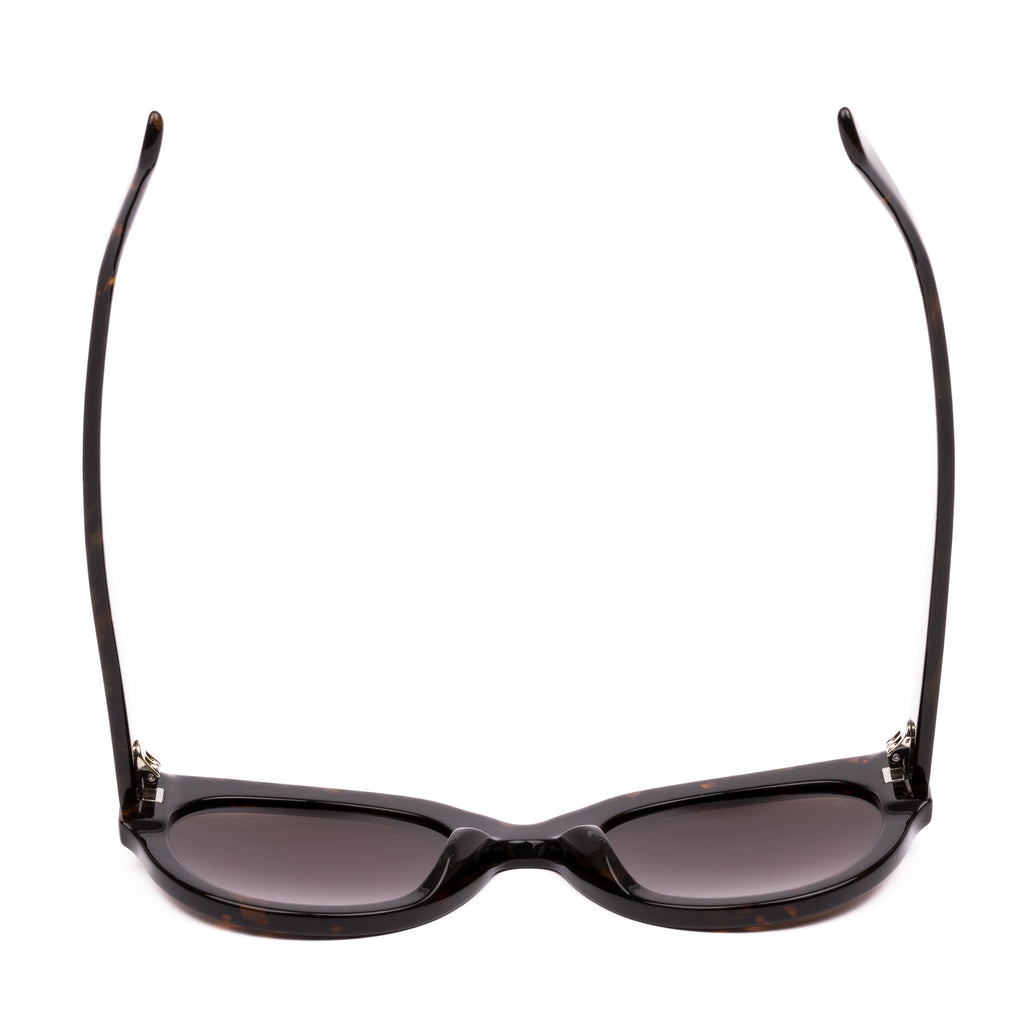 Sunglasses with tortoiseshell frame and brown lenses on a white background