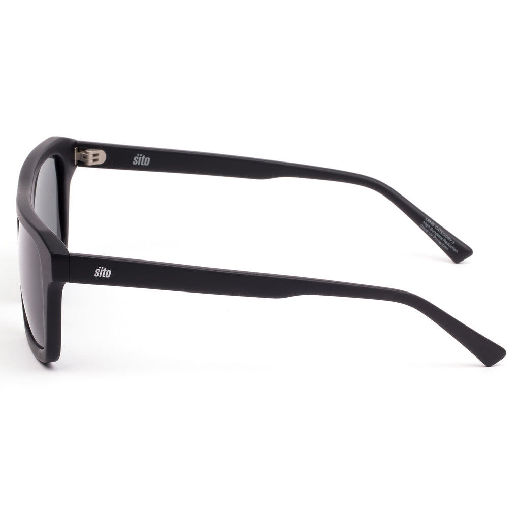 Black sunglasses with dark lenses on a white background